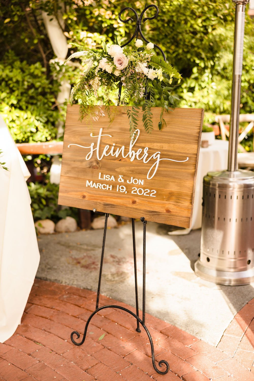 Rustic wood wedding welcome sign at the Inn at Seventh Ray in Los Angeles.