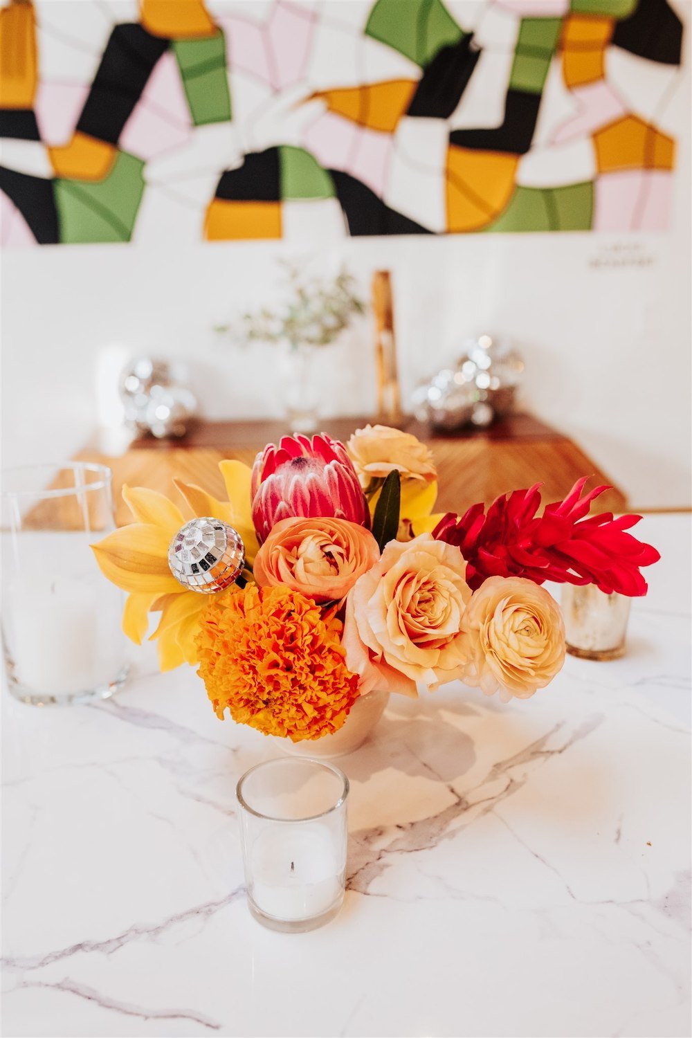 Retro 70's themed floral centerpiece at Kim Sing Theatre in Los Angeles.