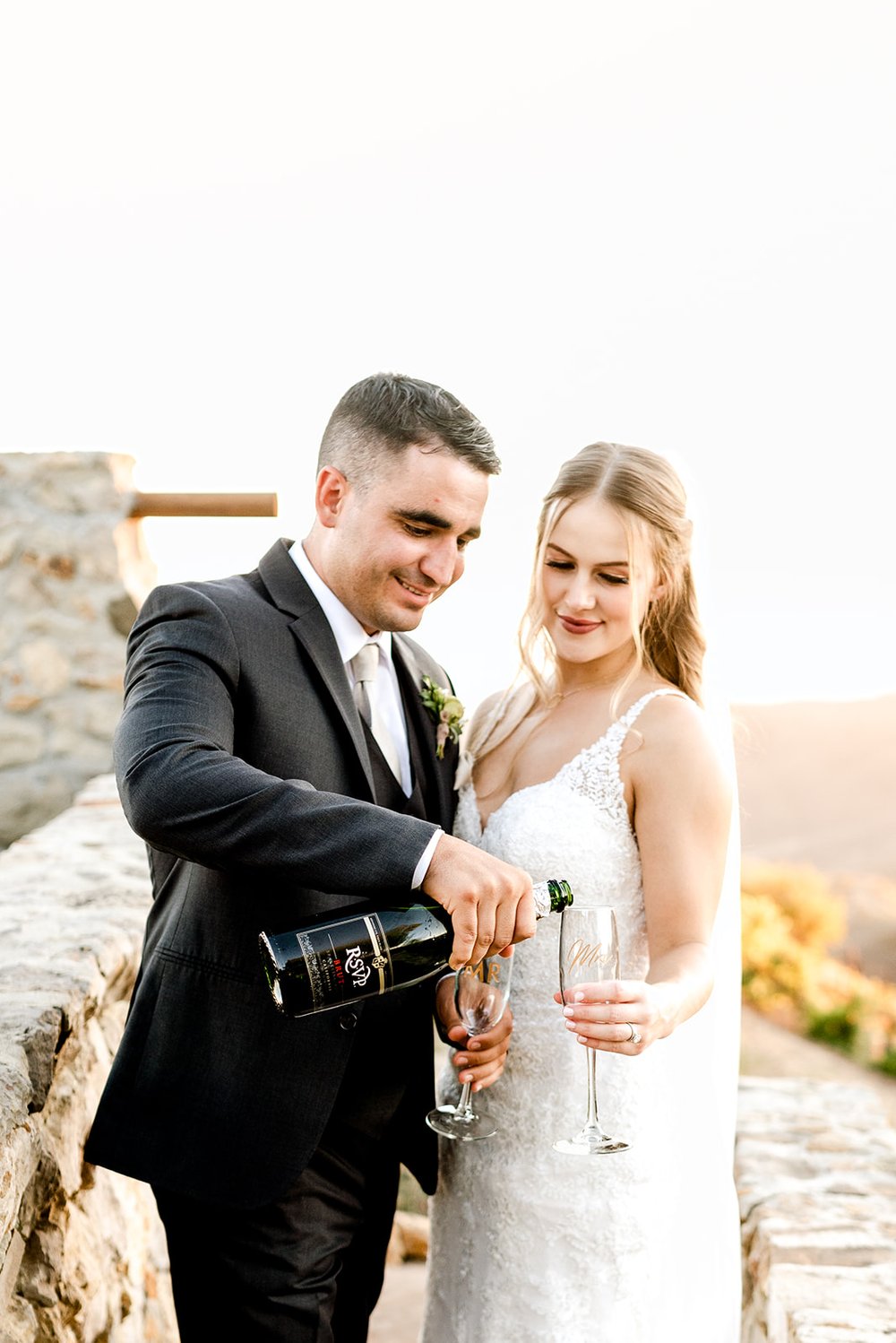 Bride and groom celebrating their perfect wedding with champagne.