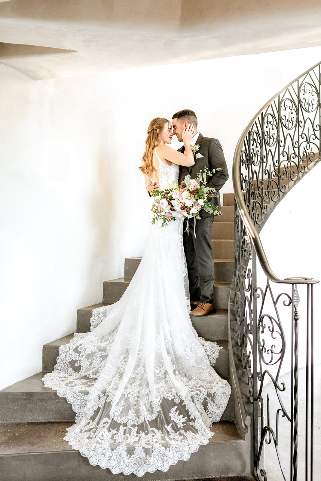 Bride and groom portraits on a iron staircase at the Malibu Solstice Vineyard venue.