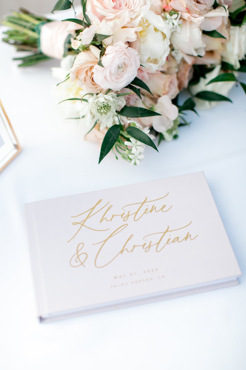 Custom gold letter wedding guest book.