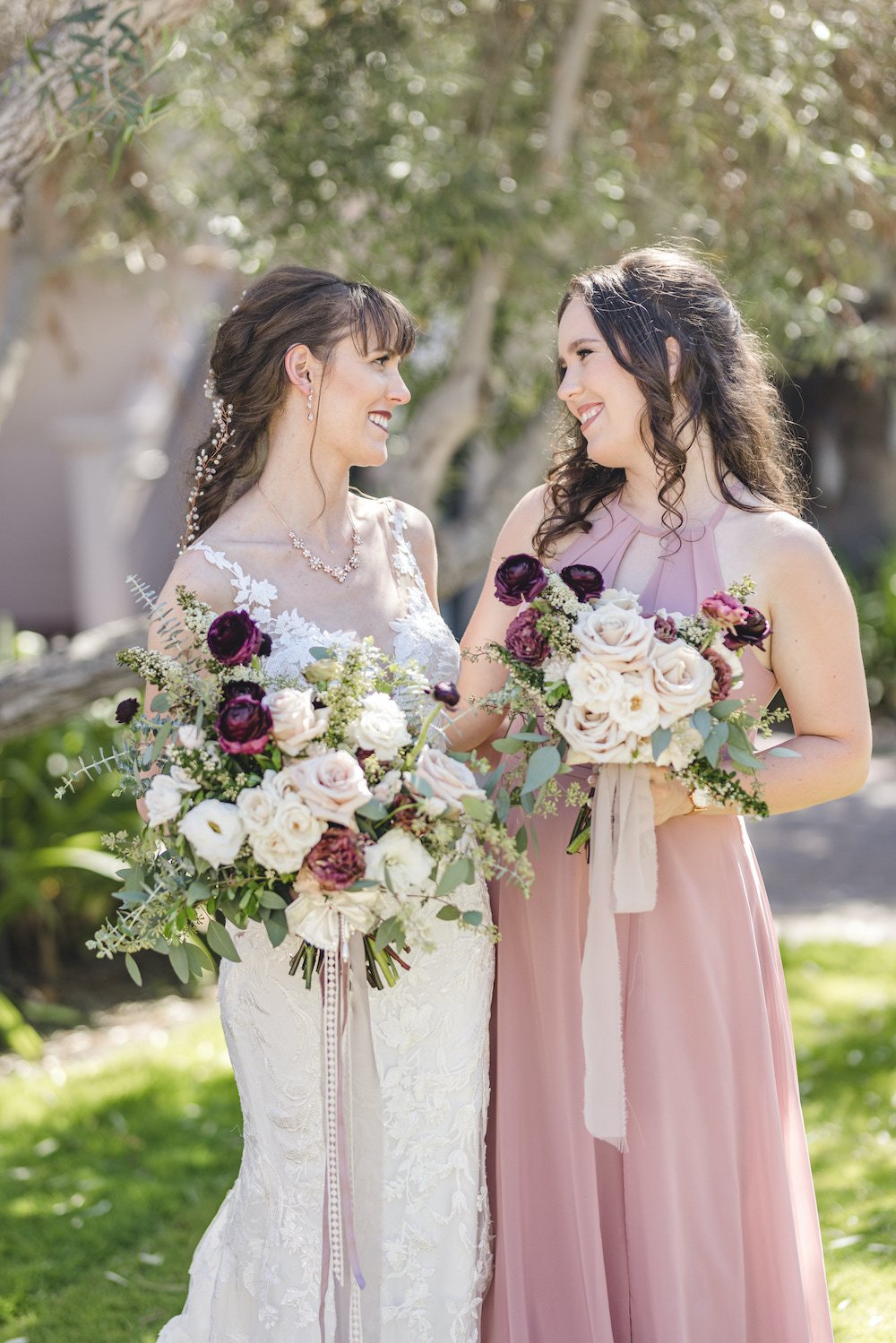  True to color wedding portrait of the bride and bridesmaid. 