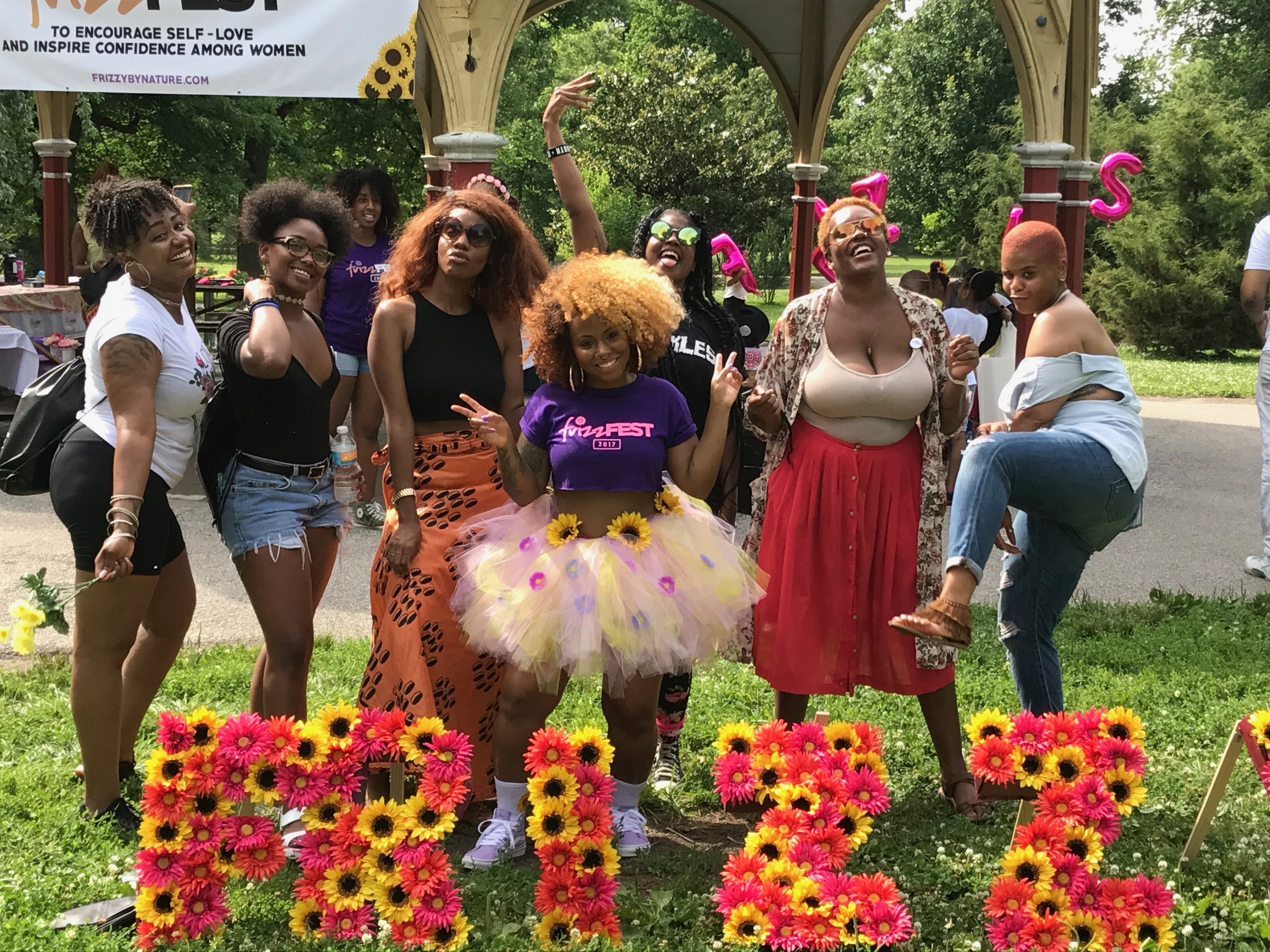 Leslie, pictured in purple, along with her supporters at 2018 Frizz Fest