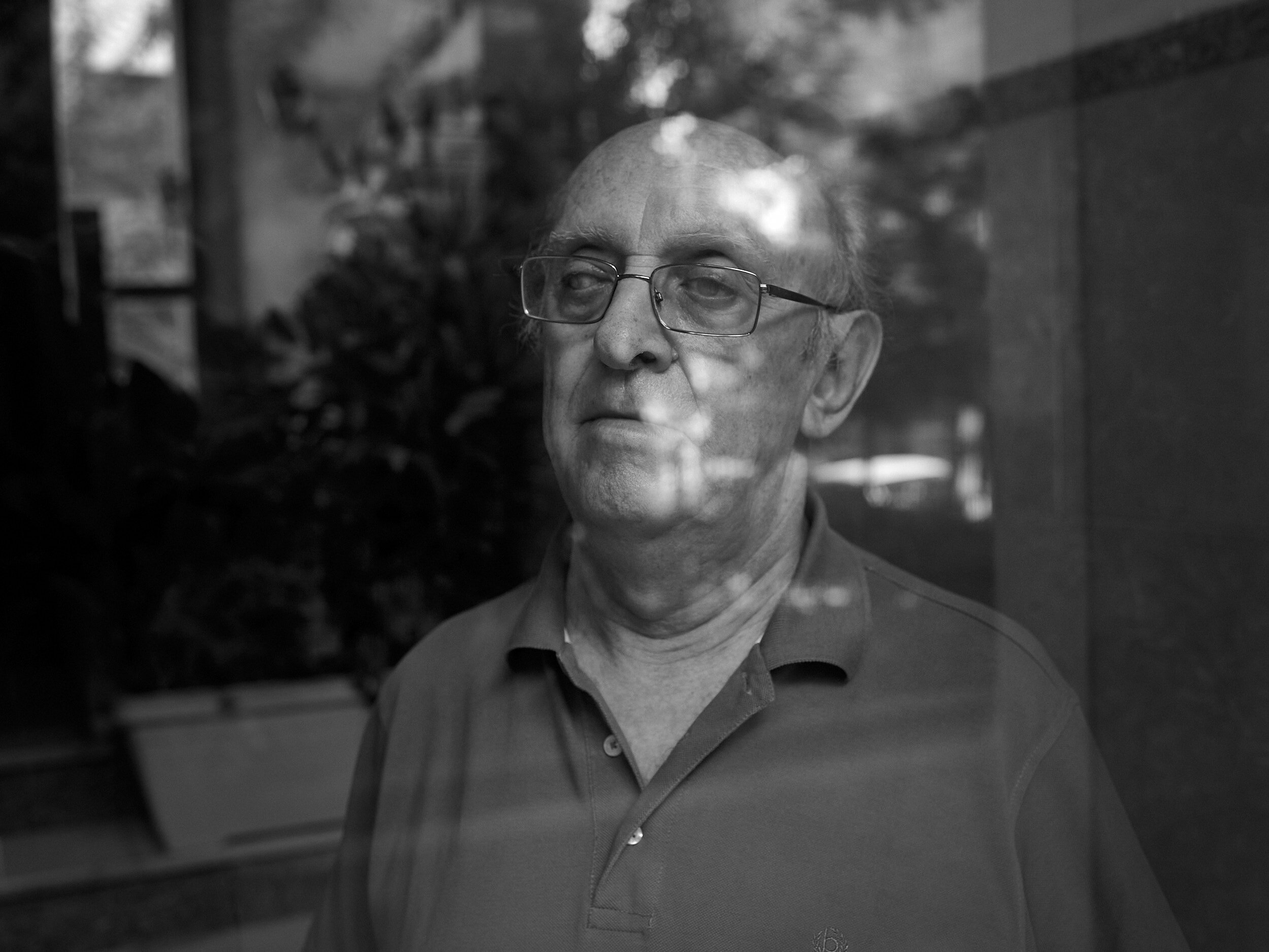 Writer Petros Markaris poses at his house in Kypseli district.