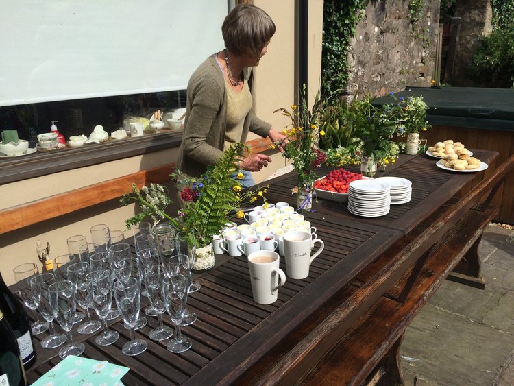 families cream tea in garden.jpg