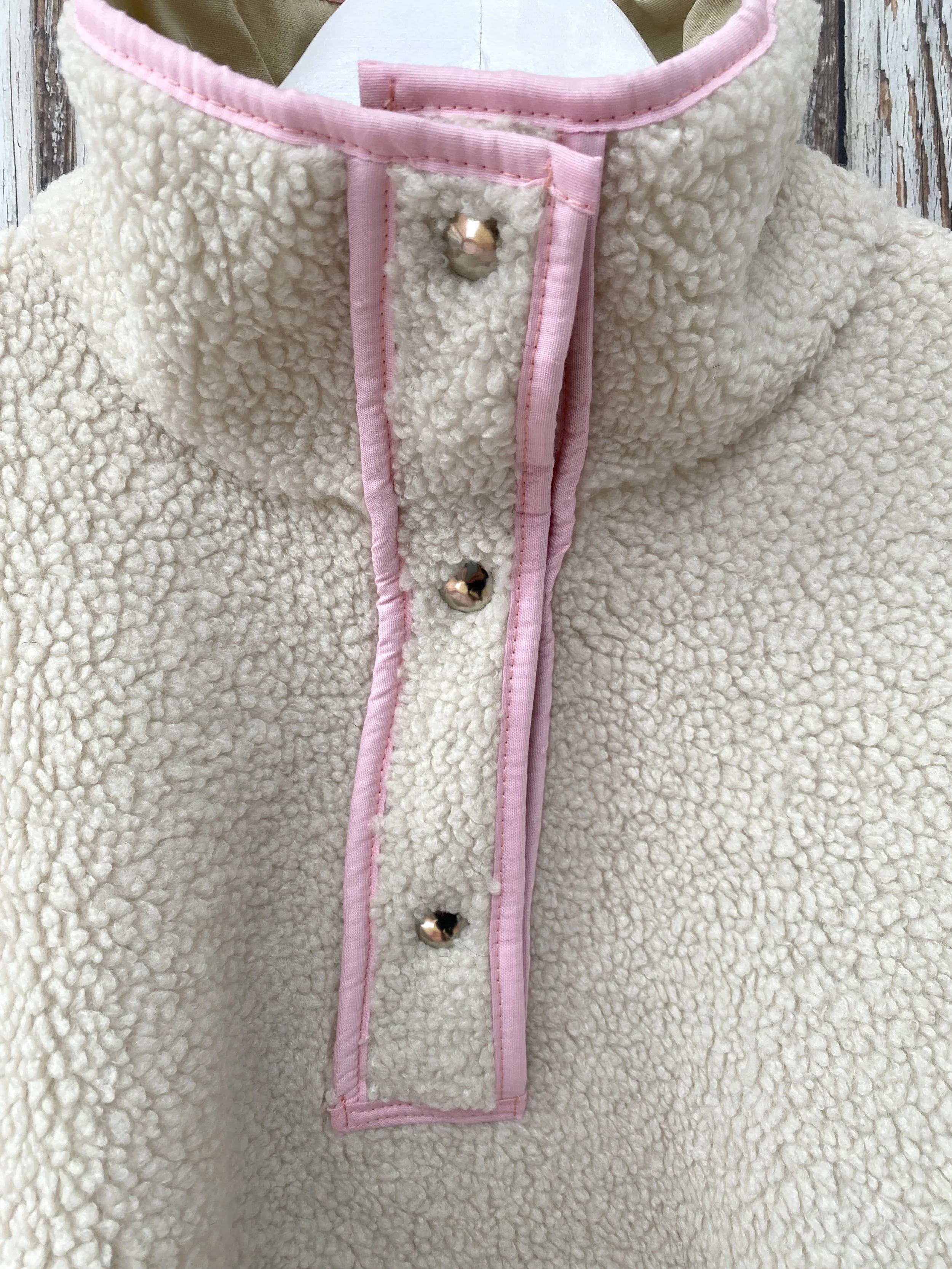 High neck fleece pullover in beige with pink detailing