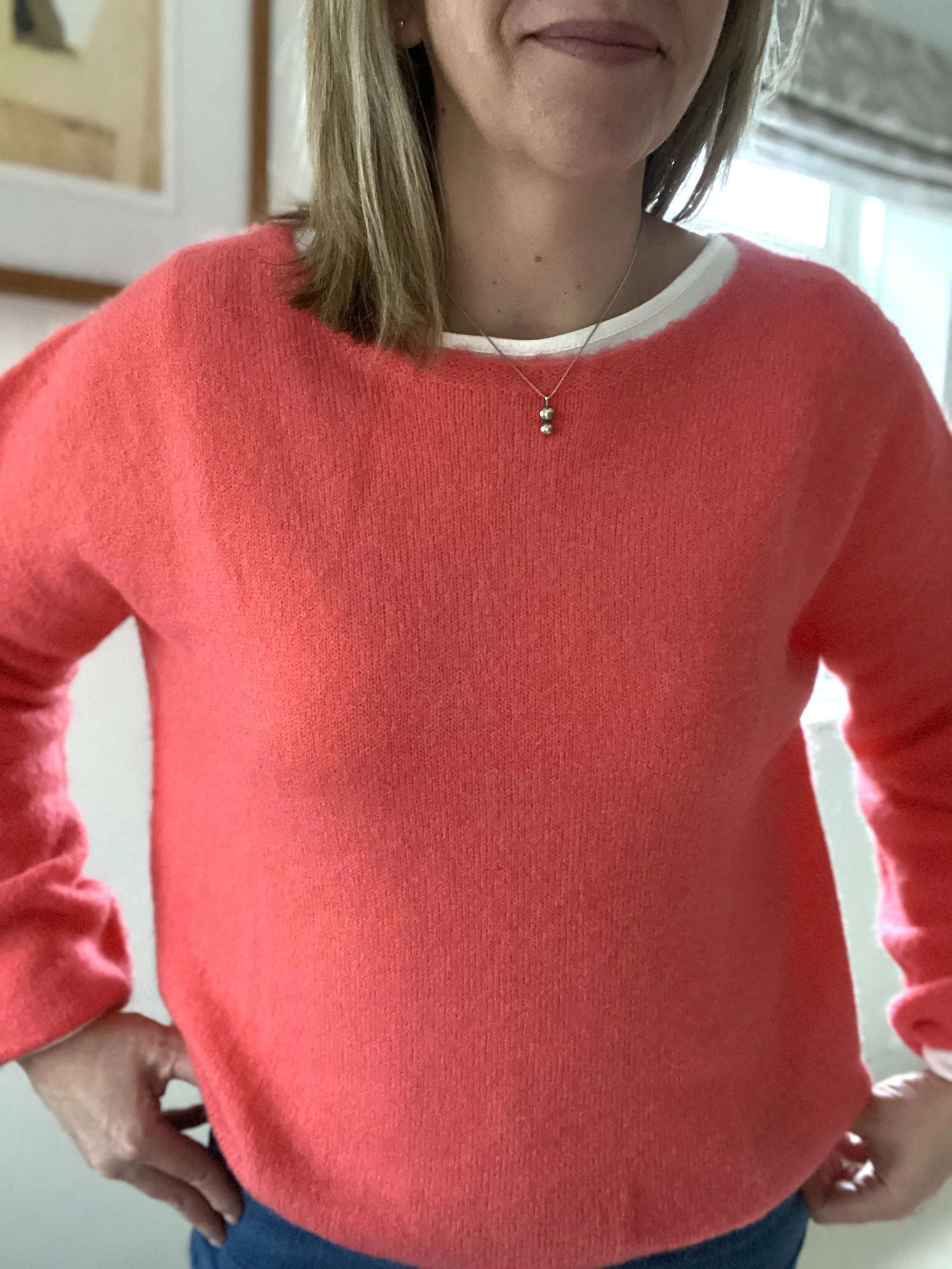 coral colour alpaca jumper on model