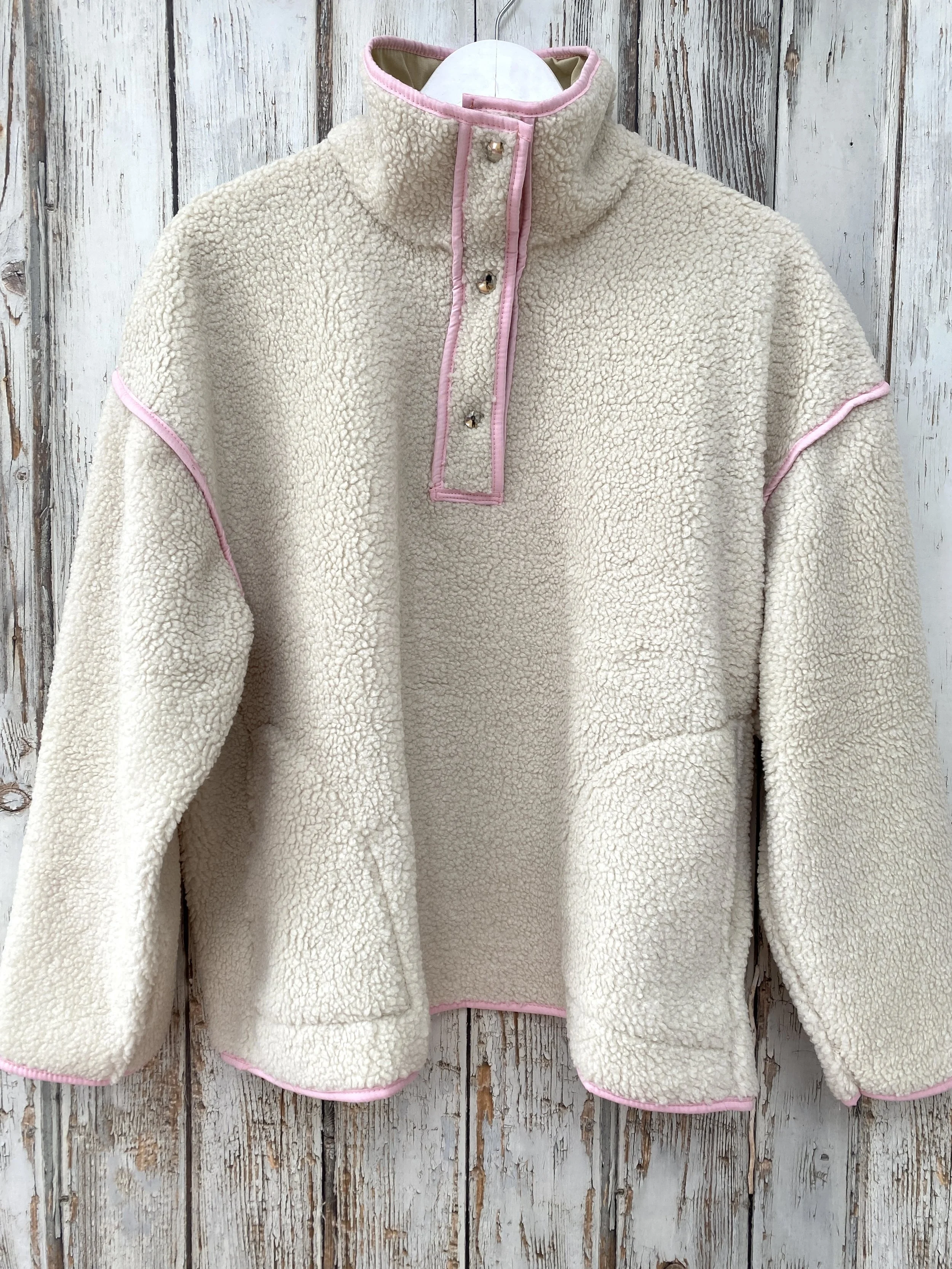 Beige and pink fleece sweatshirt