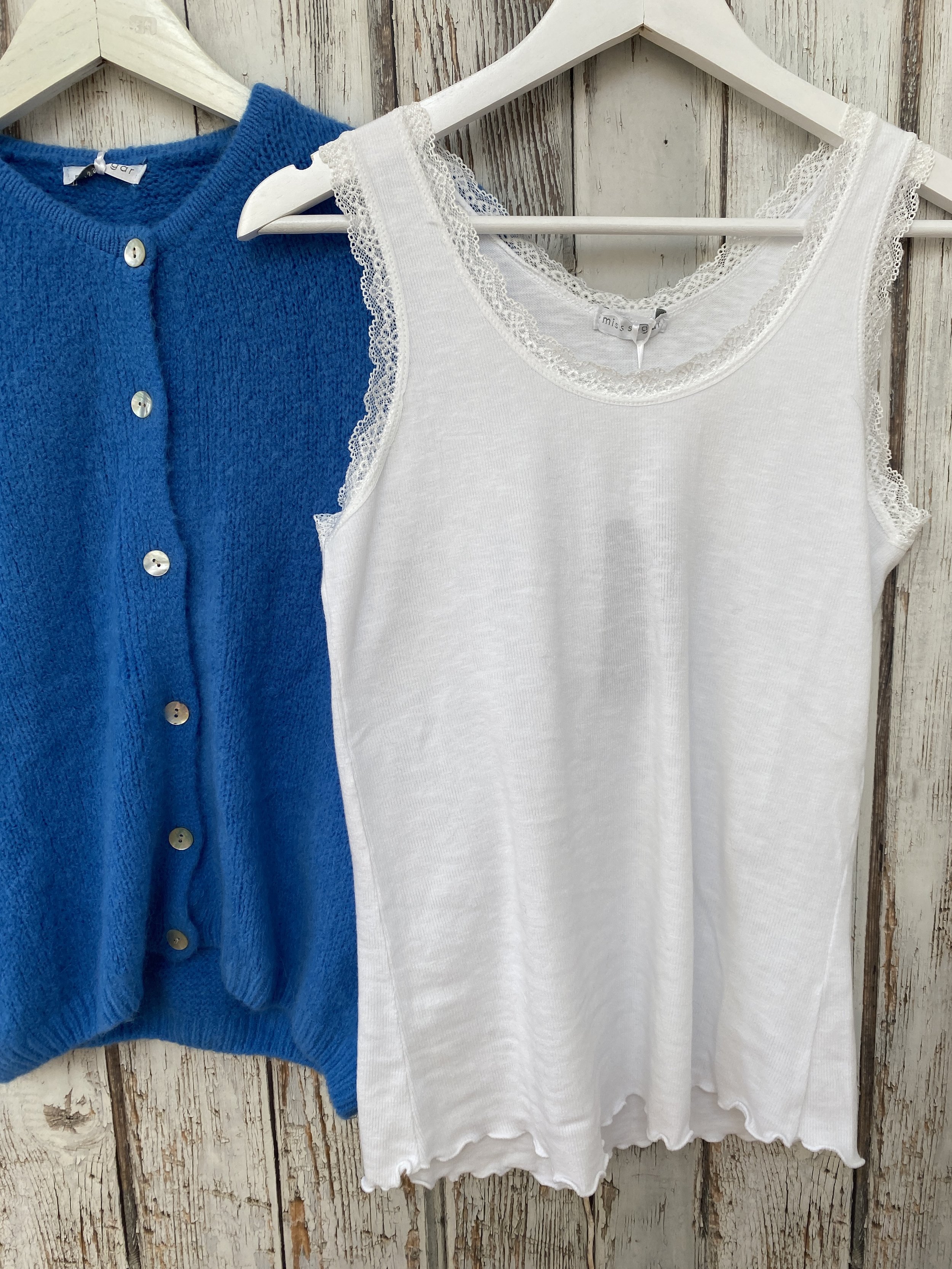 White lace trim edge vest top with an azure blue cardigan