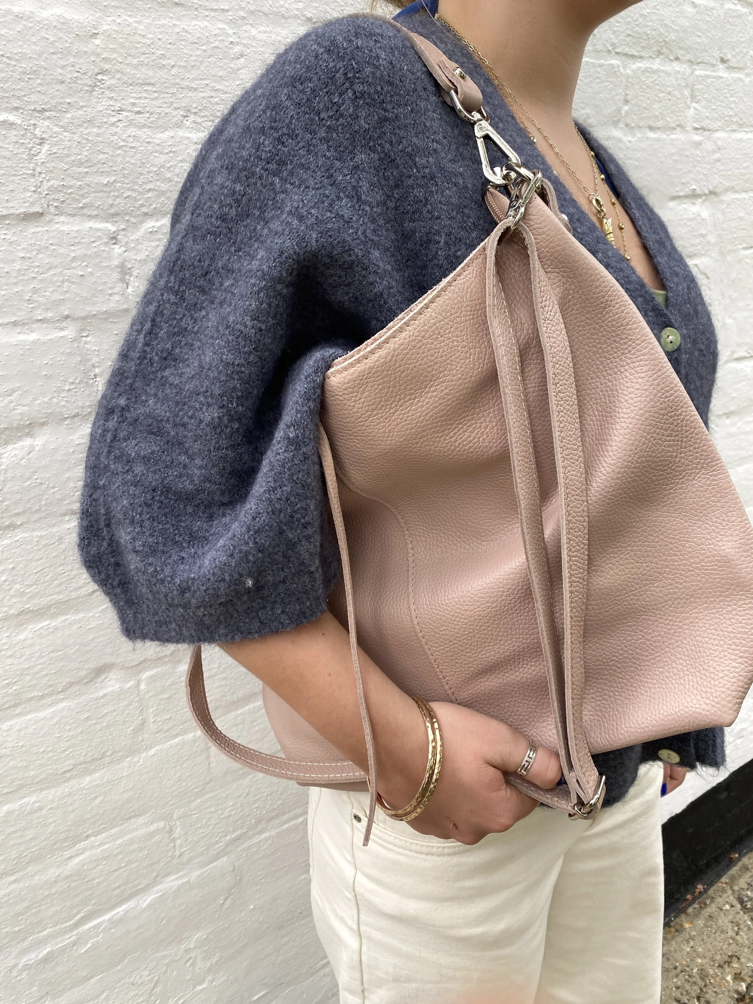 model with grey cardigan and pale rose pink large leather bag