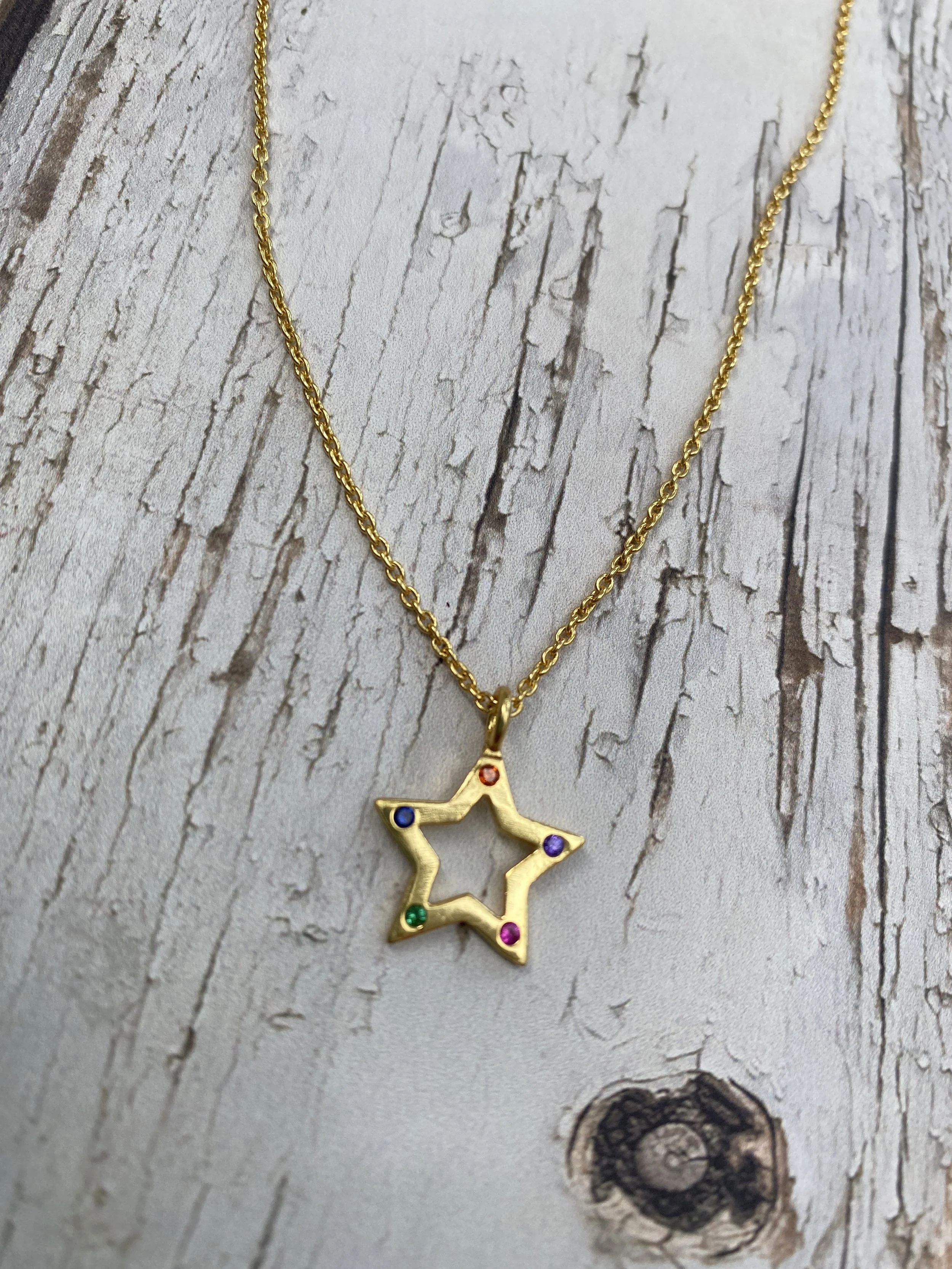 Gold necklace chain with a gold star pendant