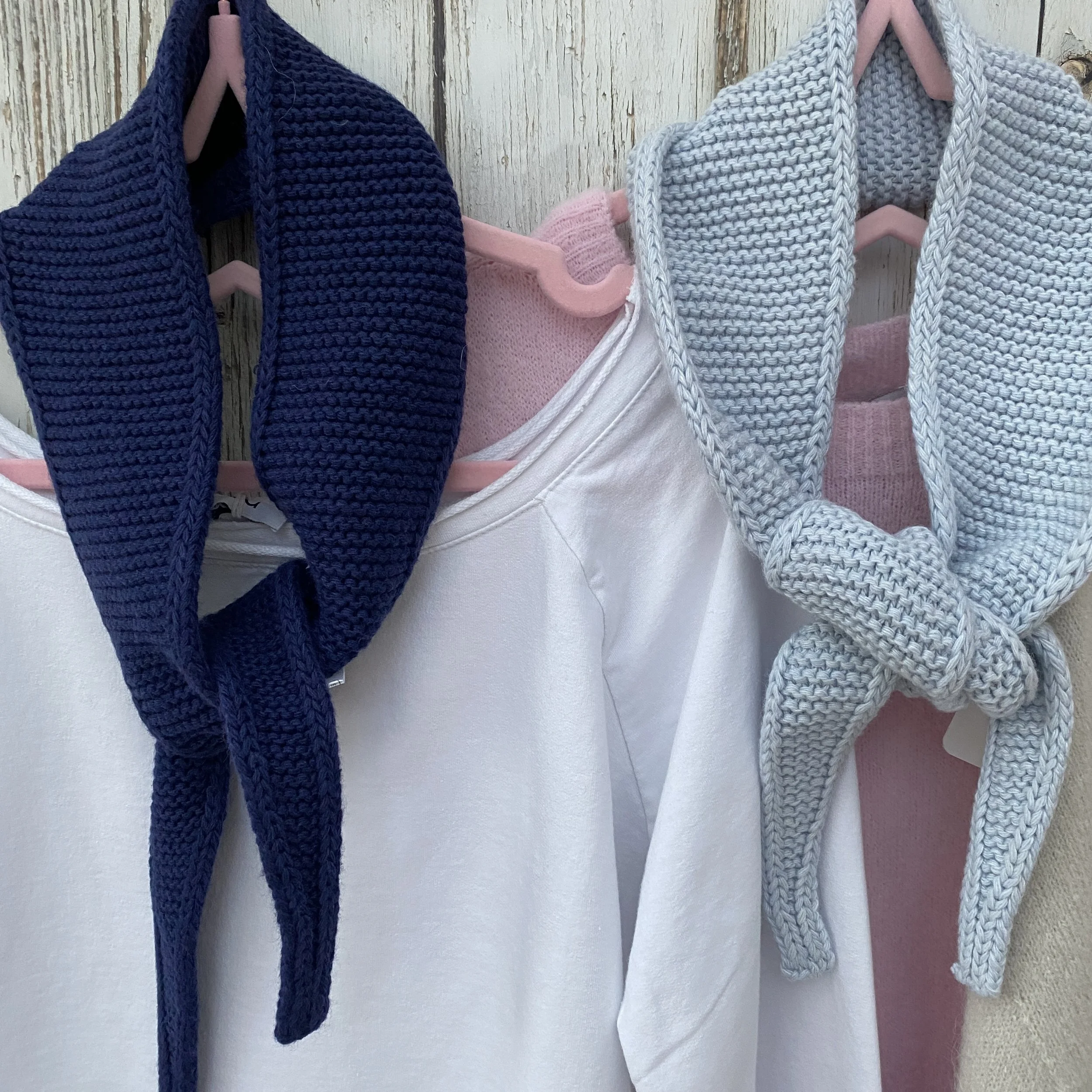 navy and a pale blue knitted neck scarf