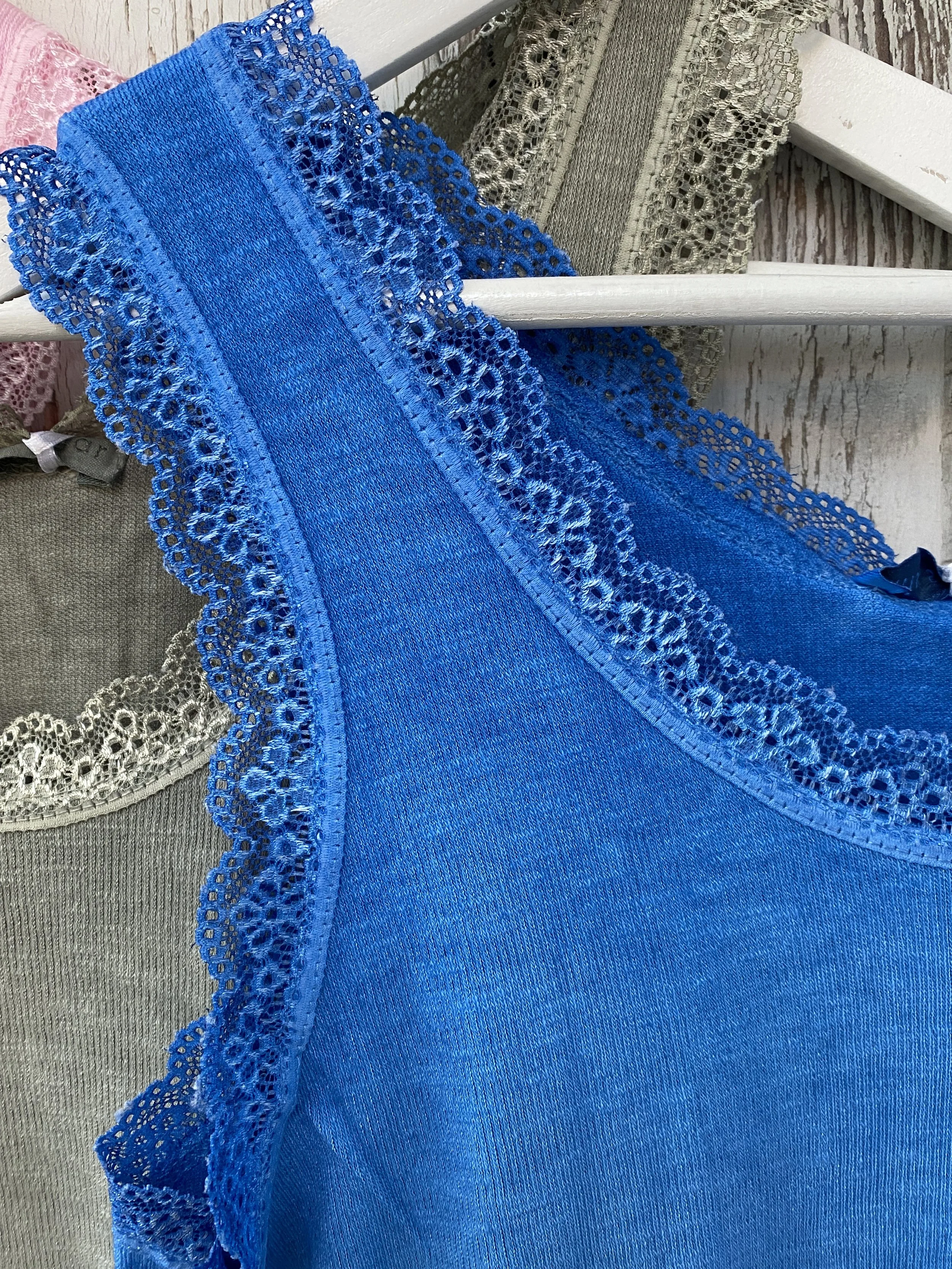 Royal Blue lace trim vest top on a hanger
