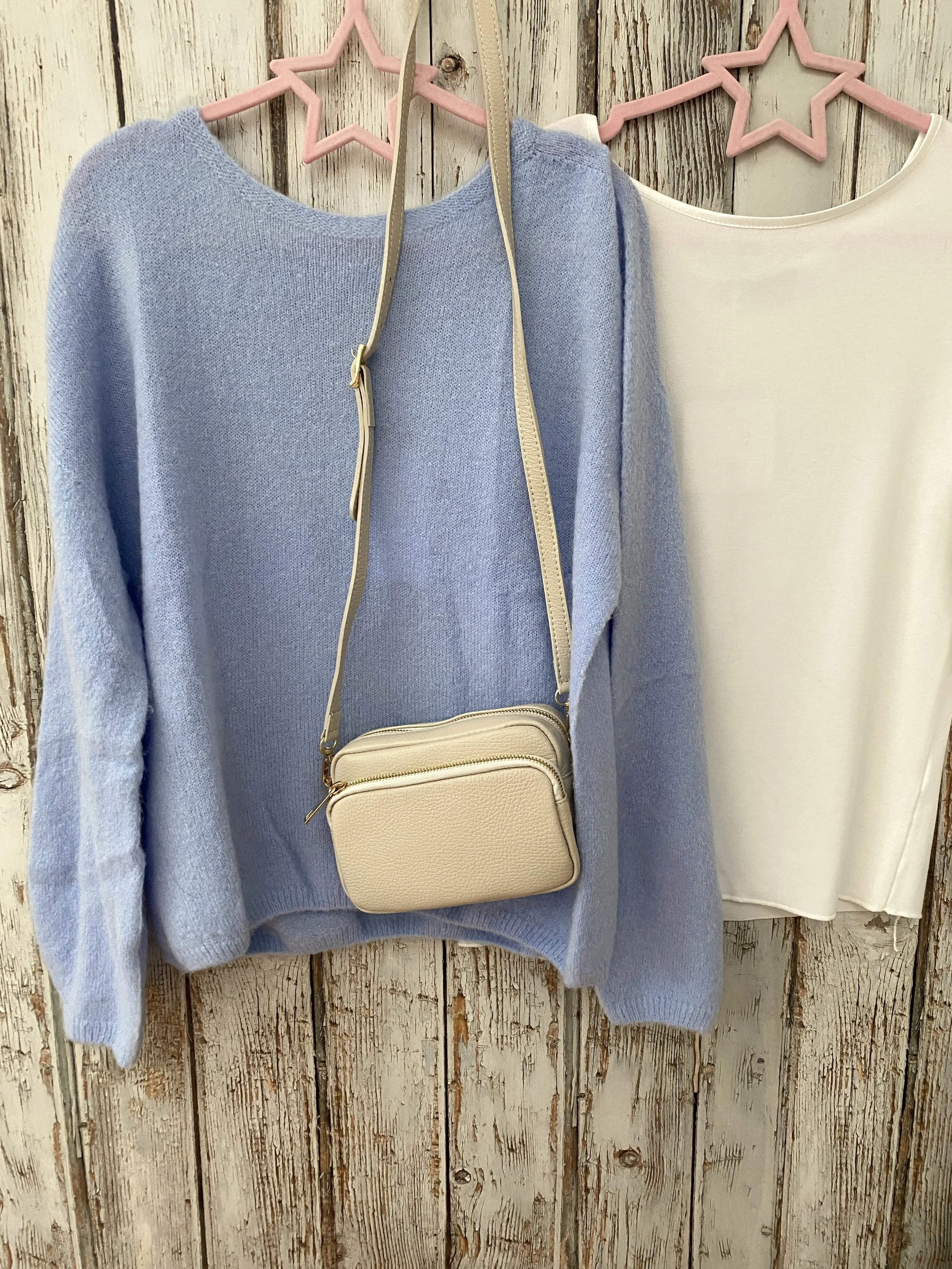 sky blue jumper with cream bag and top