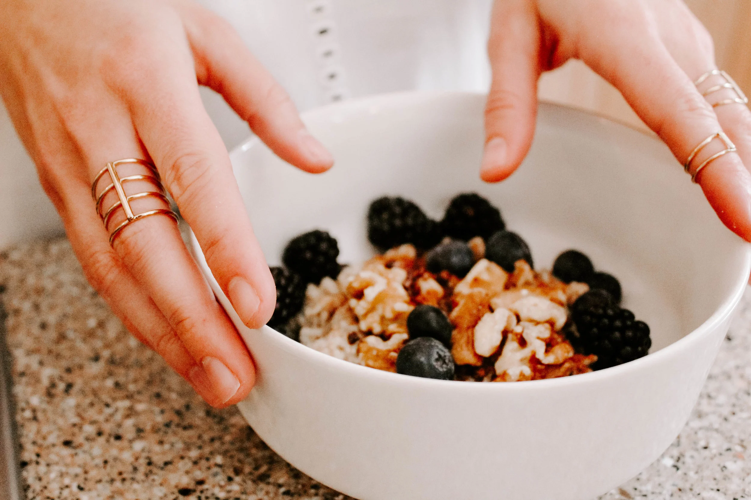 Oatmeal topped with cinnamon, walnuts, blueberries, and blackberries