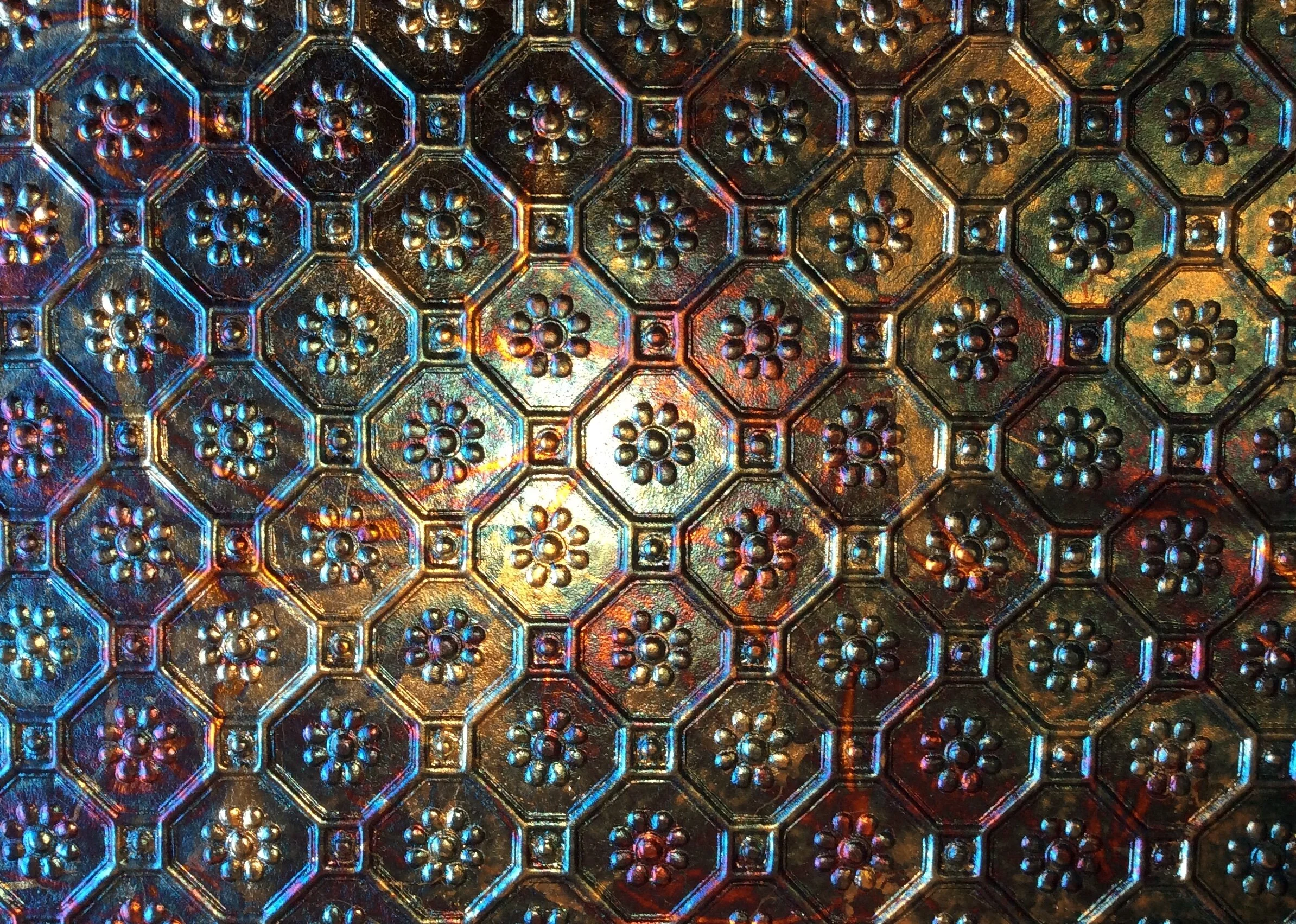 Iridescent variegated metal foil finish