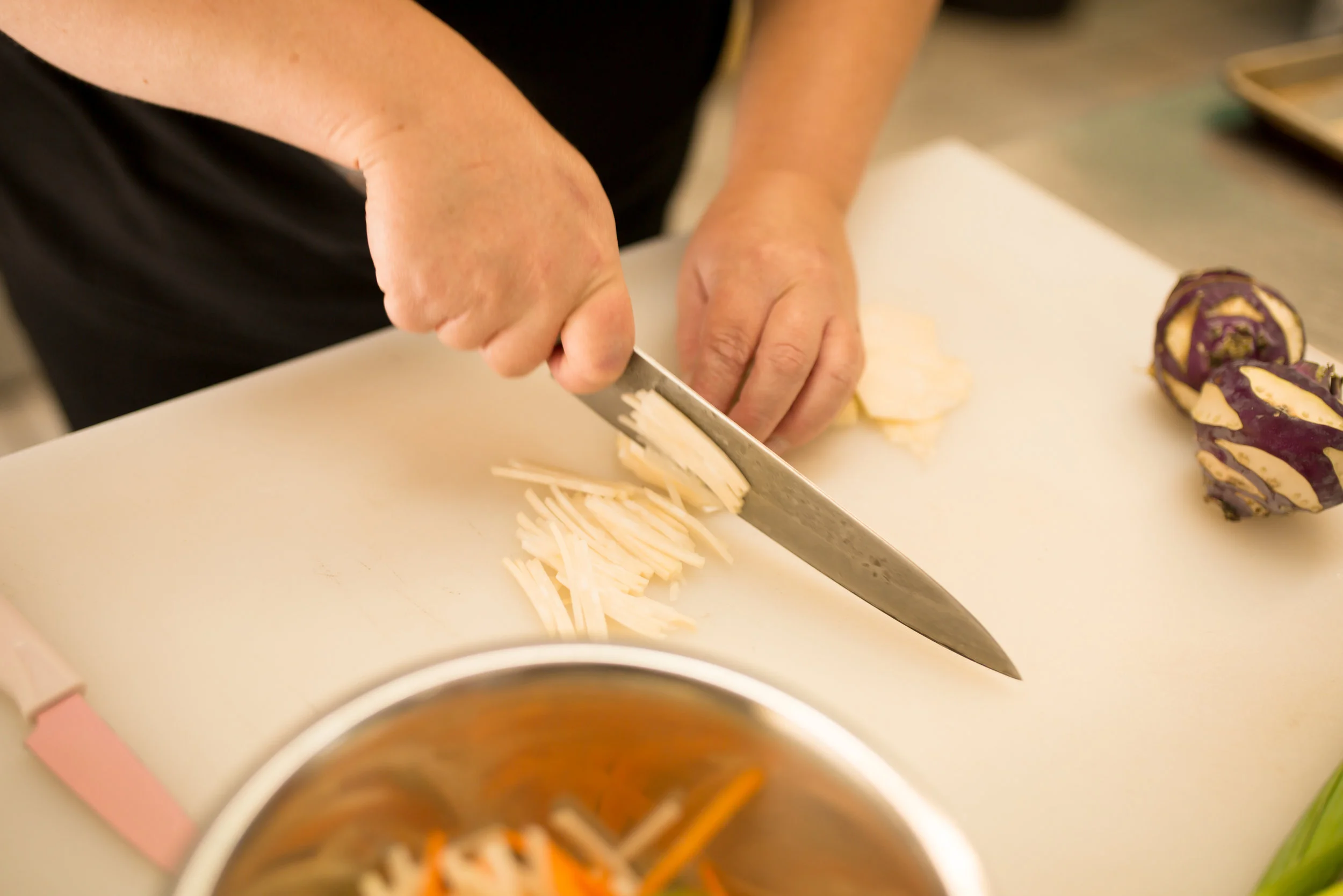 Chef Kendra Smith prepares a kohlrabi for a delicious kohlrabi coleslaw