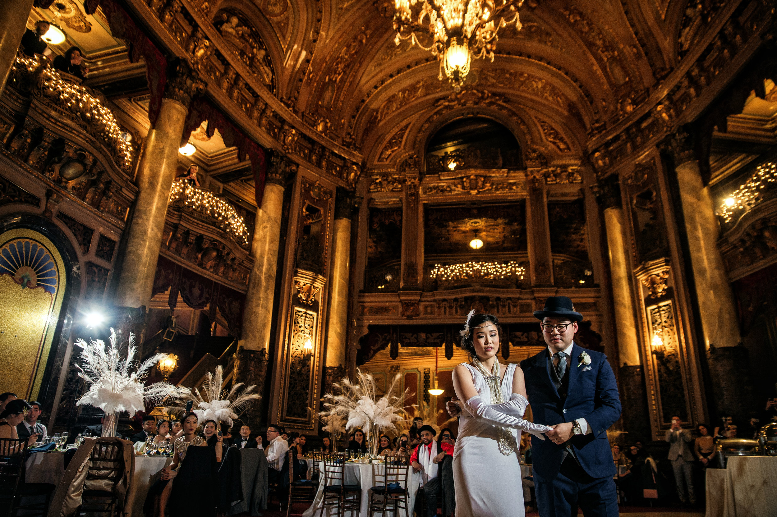 Beautifully picture of 20's Inspired bride and groom dancing at reception at historic Loew’s Theater in Jersey City
