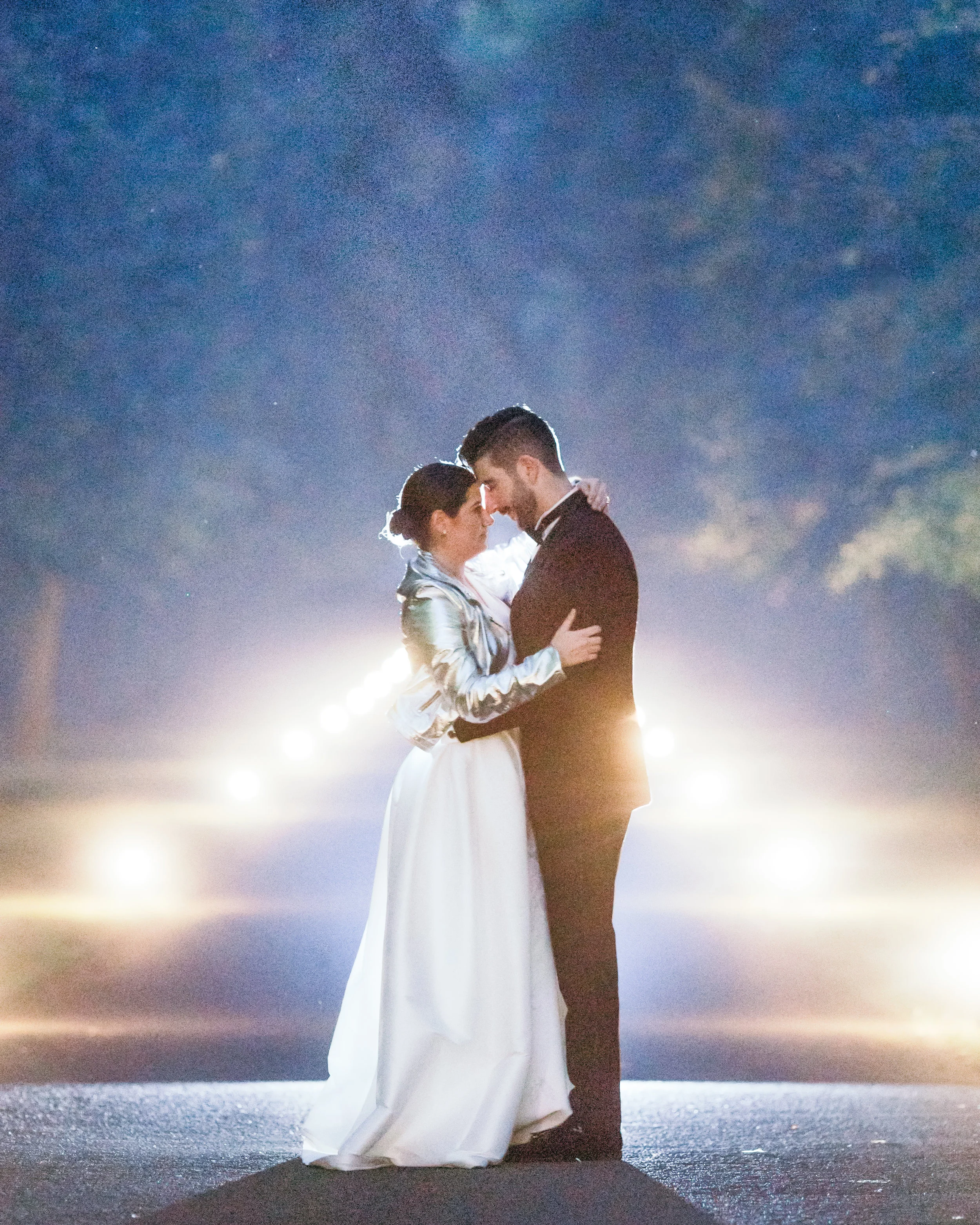 Beautiful portrait of bride and groom outside the Scotland castle surrounded at night