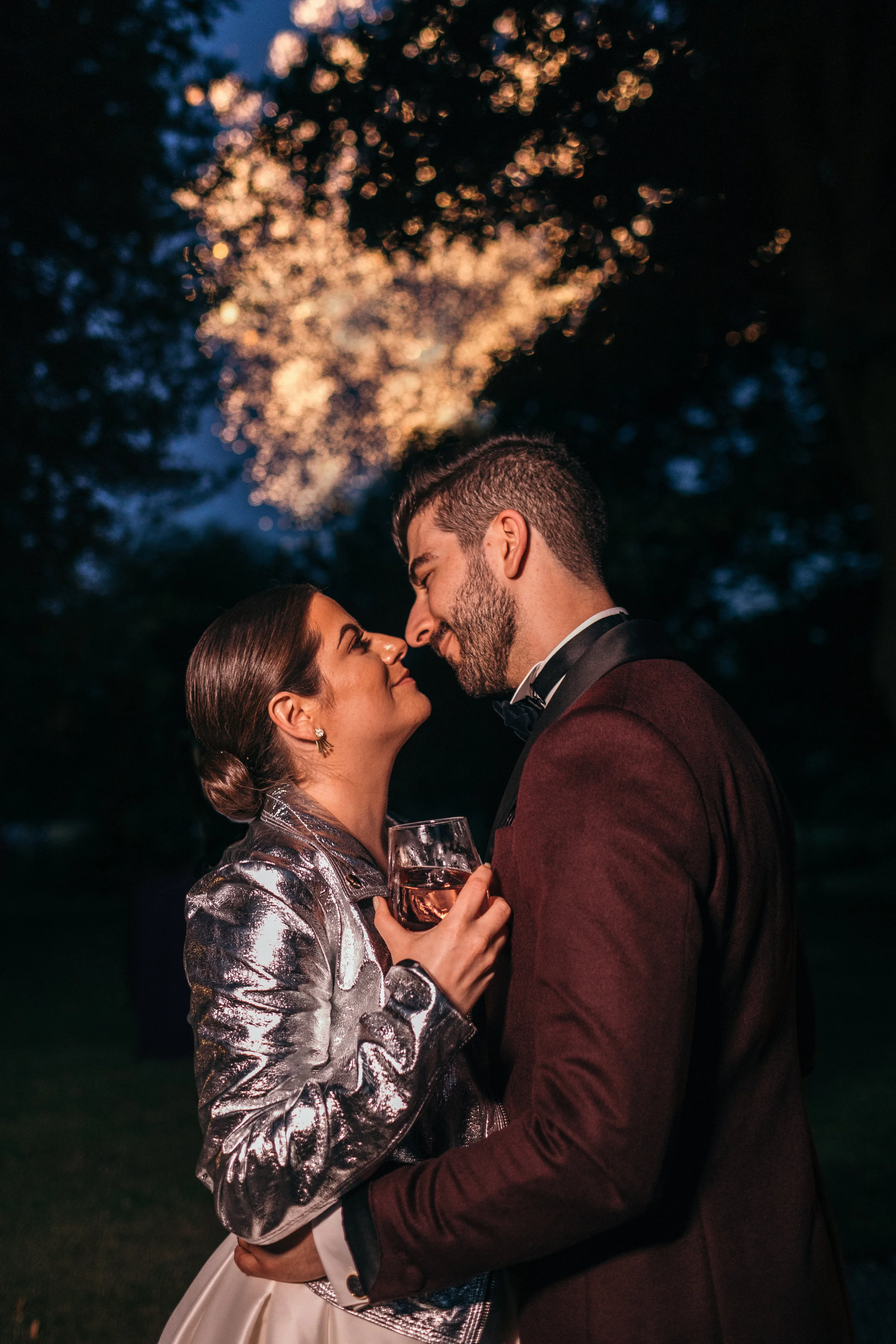Bride and groom shooting gazing at each other at night in Scotland castle outdoor wedding
