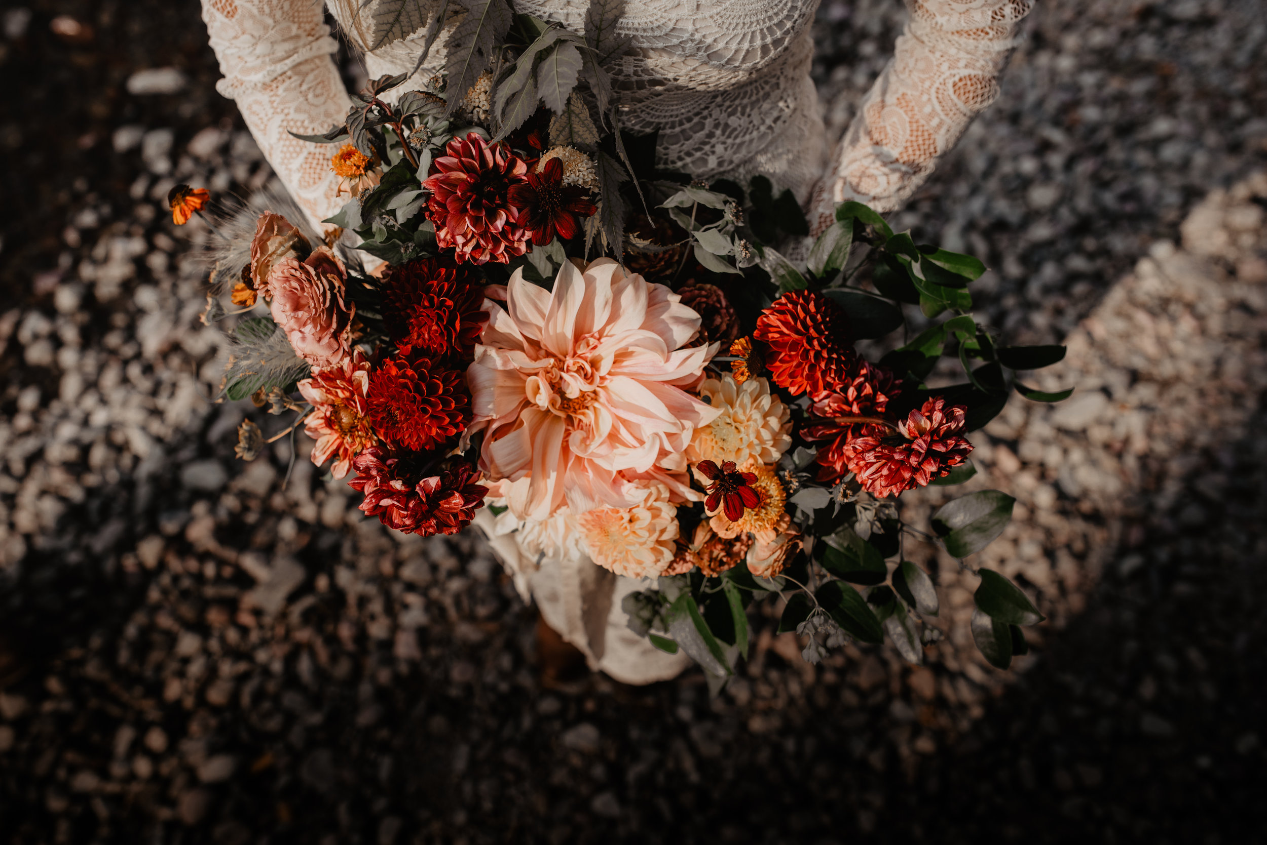 Local and ethically sourced wedding orange, red, green and peach flower bouquet