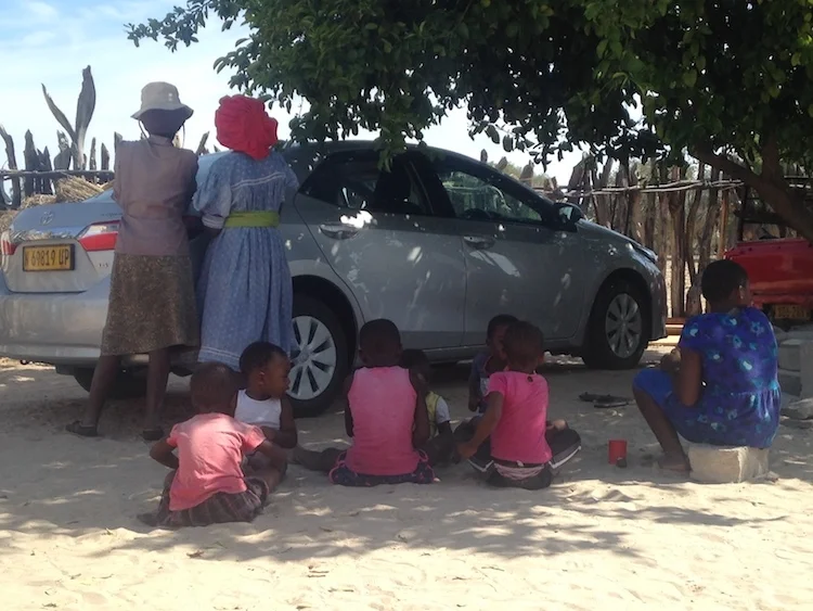 My son facing the camera, playing with his cousins in the village,