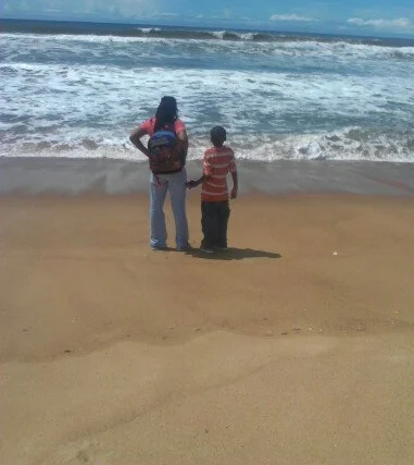 Teri and Son at Beach in Liberia.jpg