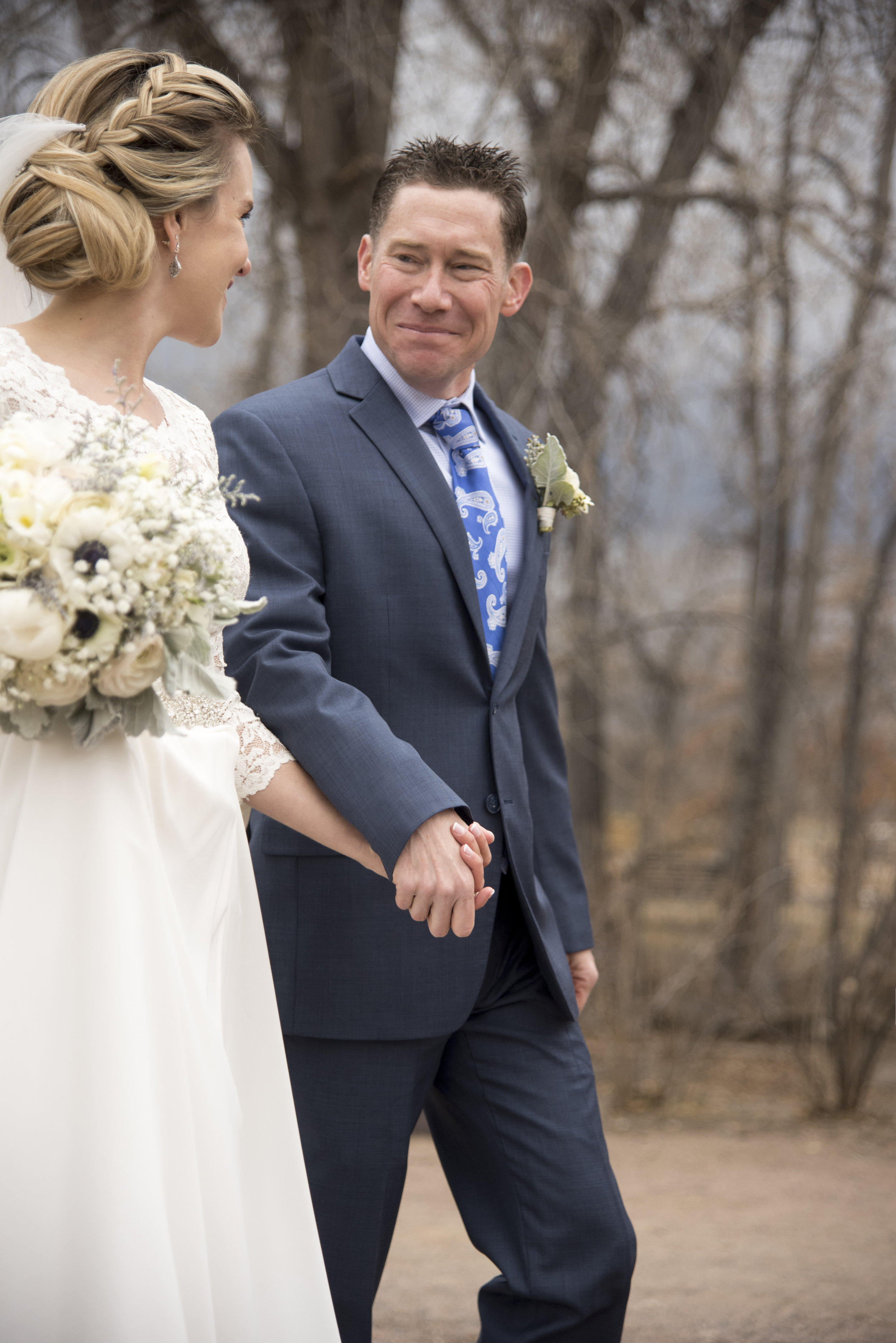 Groom smiling looking at bride | Mary and Brad's Outdoor Wedding at Hudson Gardens | Colorado Springs, Colorado Photographer | Farm Wedding Photographer | Apollo Fields Wedding Photojournalism