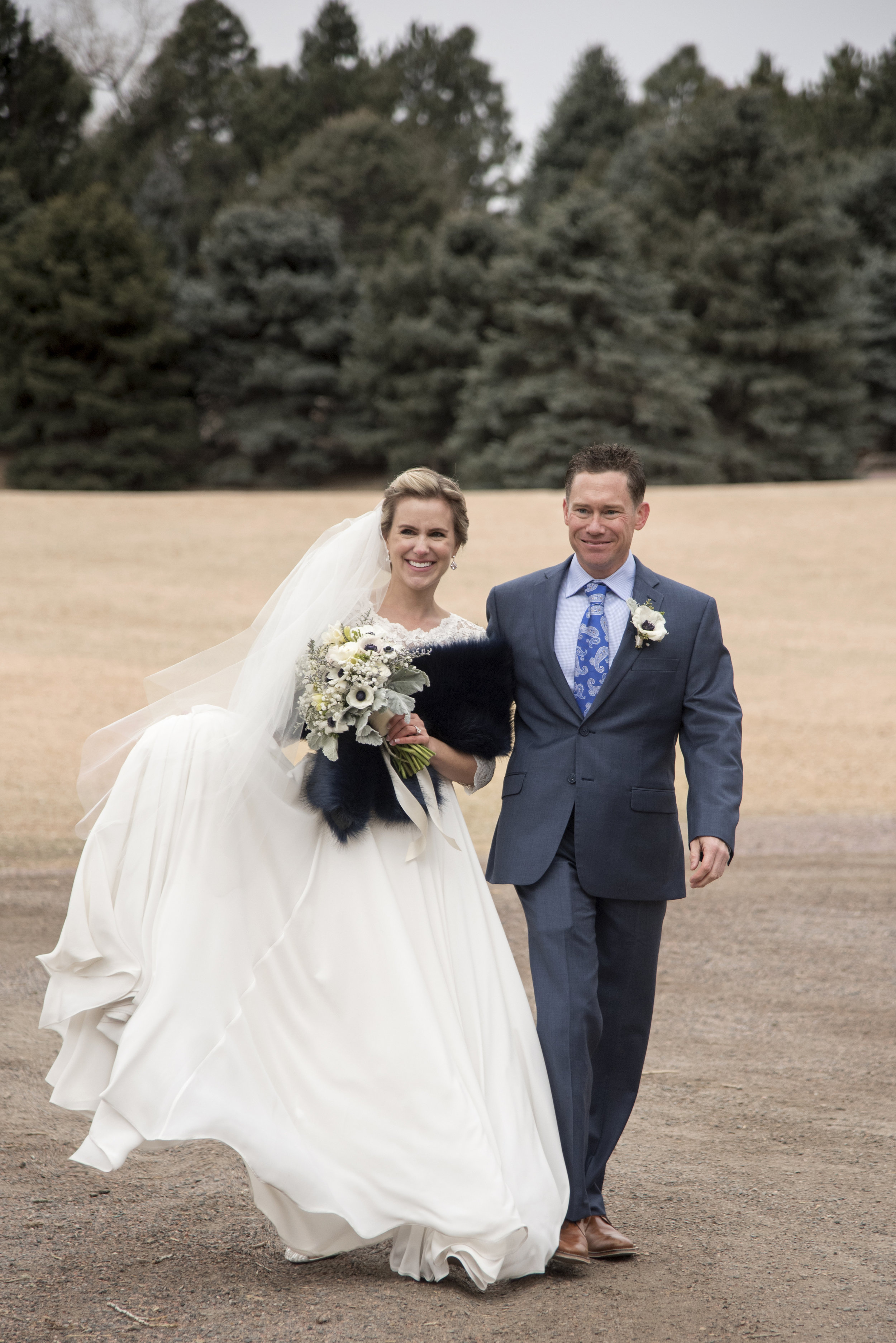 Bride and Groom walking arm in arm | Mary and Brad's Outdoor Wedding at Hudson Gardens | Colorado Springs, Colorado Photographer | Farm Wedding Photographer | Apollo Fields Wedding Photojournalism