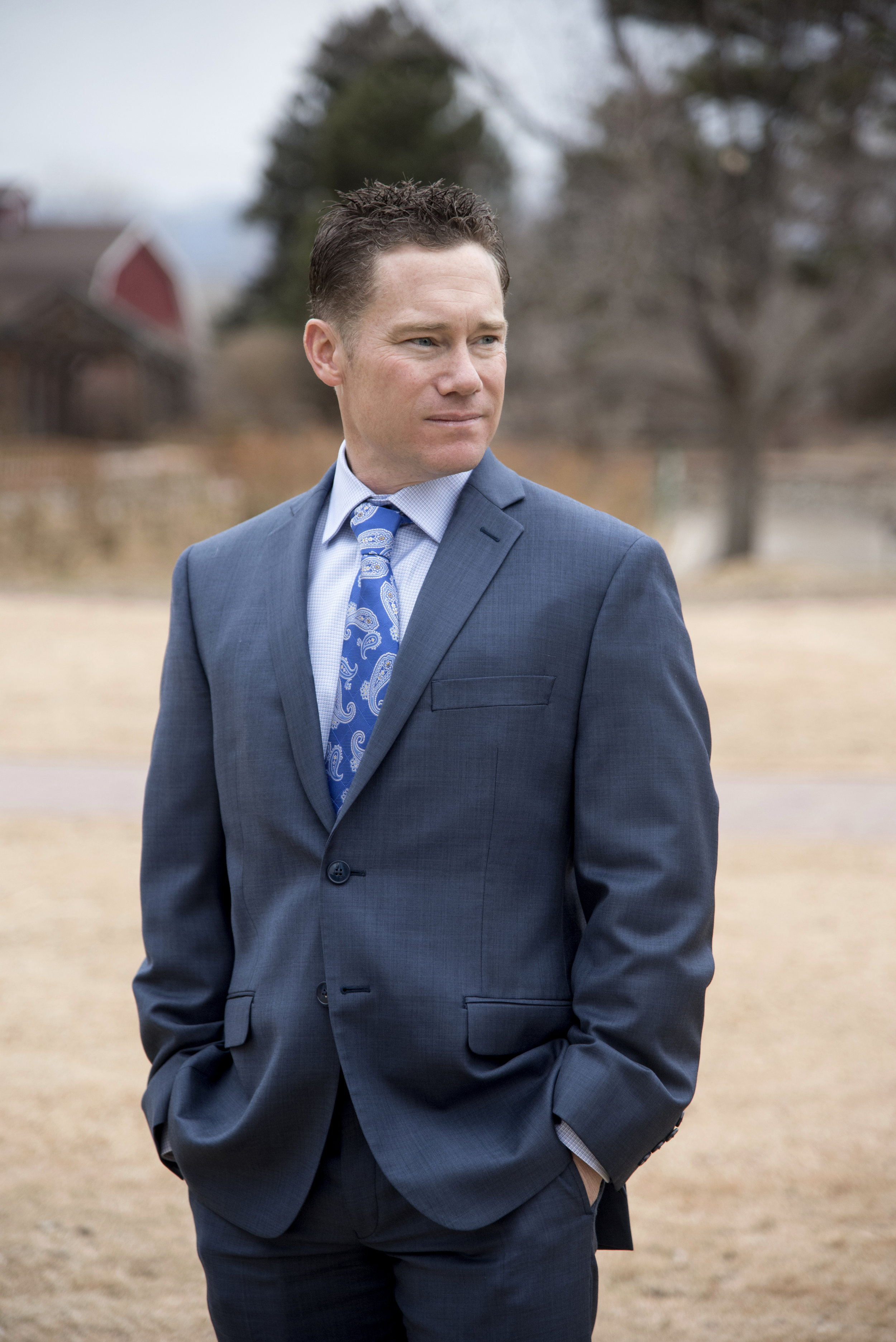 Groom standing in meadow | Mary and Brad's outdoor wedding photography at Hudson Gardens | Colorado Springs, Colorado | Farm Wedding Photographer | Apollo Fields Wedding Photojournalism