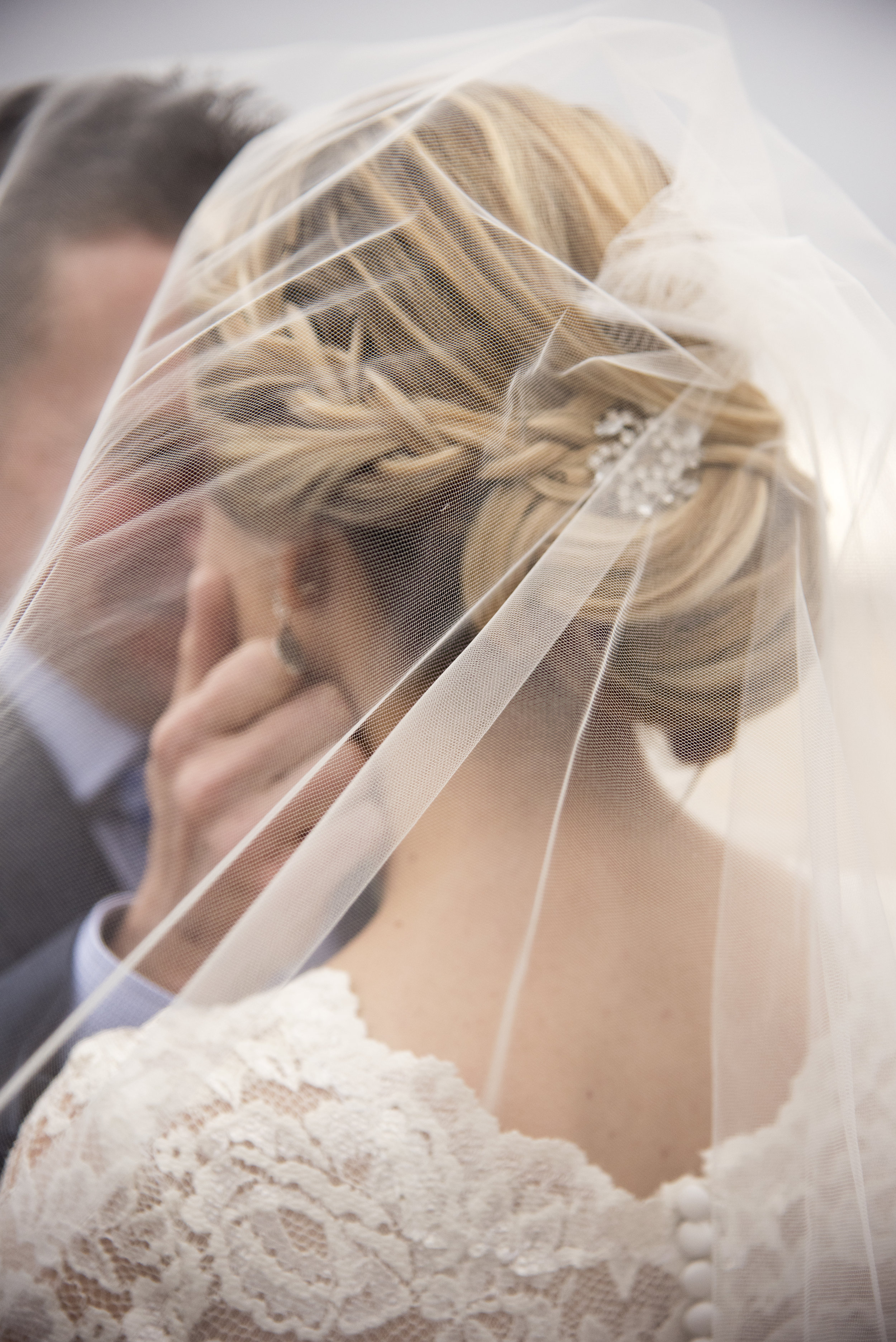 Groom intimately touching brides face under veil | Mary and Brad's outdoor wedding photography at Hudson Gardens | Colorado Springs, Colorado | Farm Wedding Photographer | Apollo Fields Wedding 