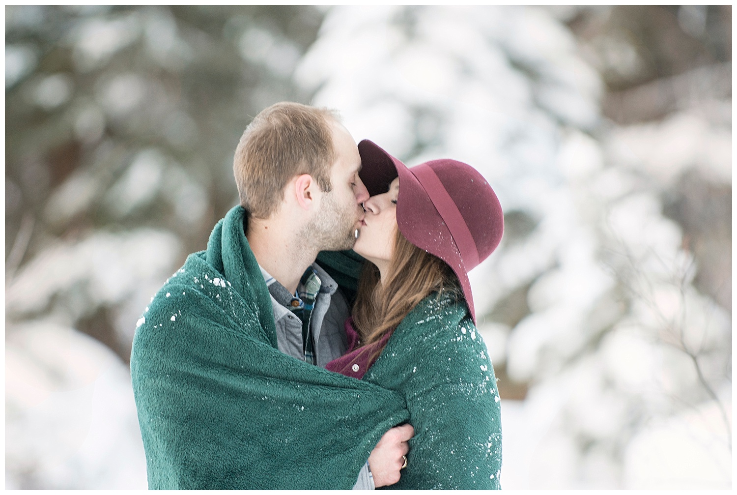 Man Kissing Woman in blanket in Snow | Breckenridge Engagement Photography | Colorado Engagement Photographer | Farm Wedding Photographer | Apollo Fields Wedding Photojournalism