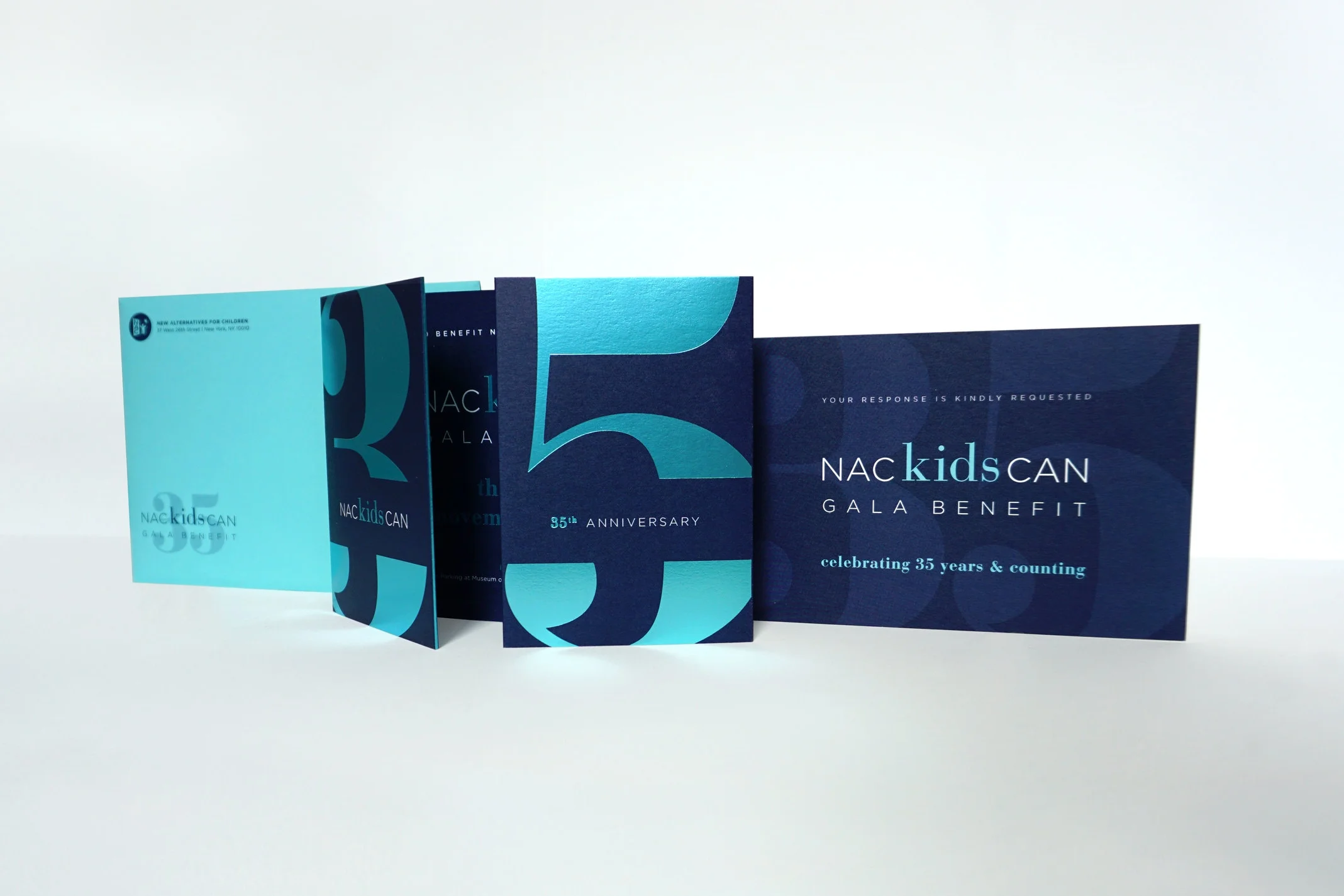 Deep blues and reflective foil stamping alludes to the event's underwater-themed location.