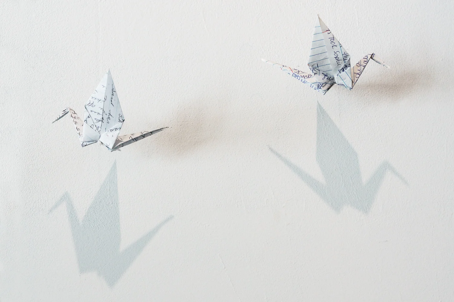 Origami cranes from notebook pages