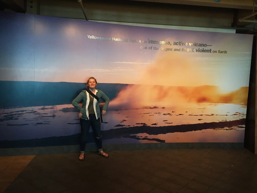 Another picture in front of the cool wall