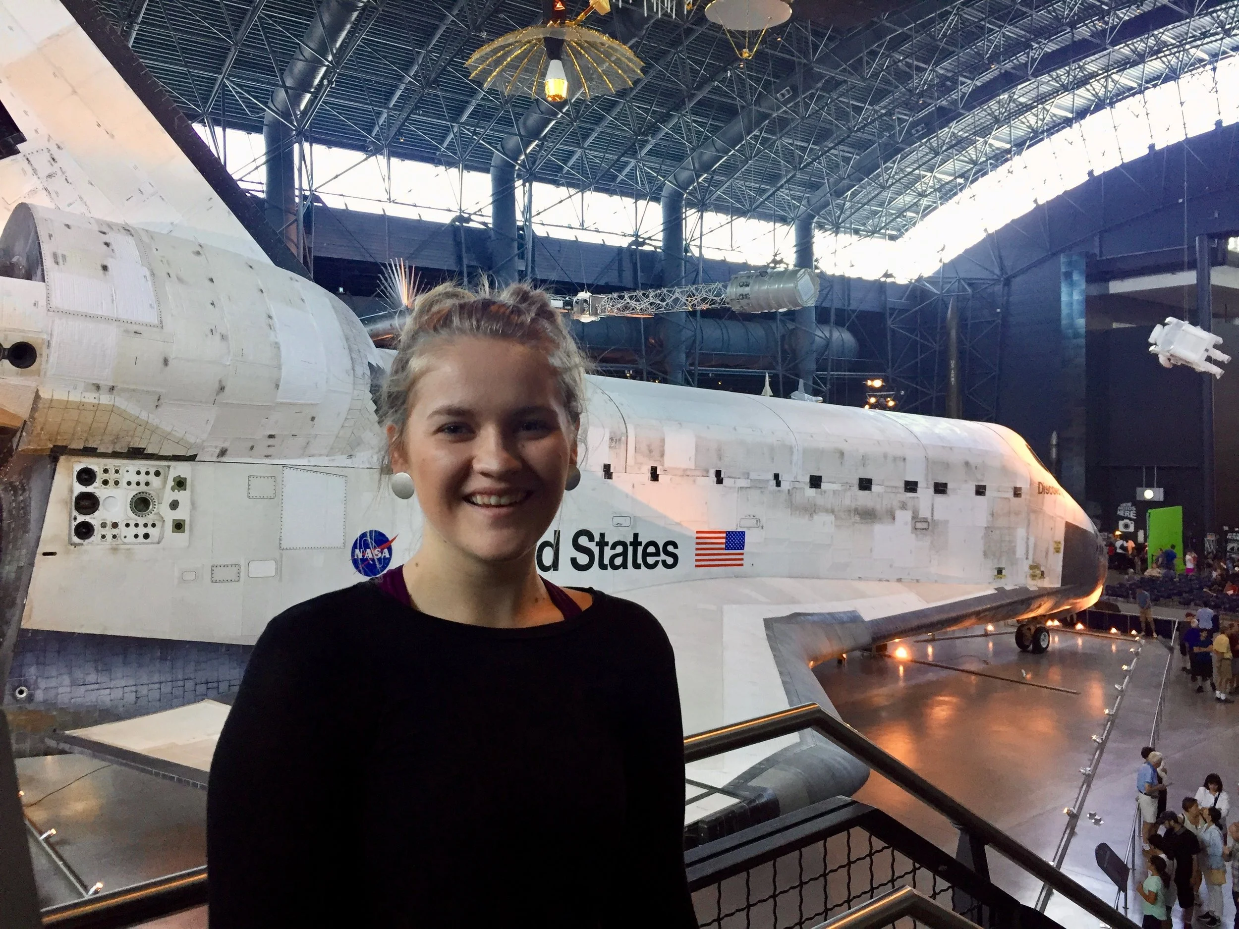Me in front of the space shuttle Discovery at the Smithsonian National Air and Space Museum