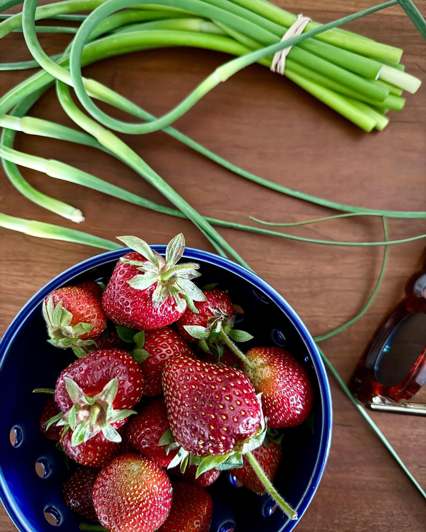 The start of Summer = strawberries and garlic scapes. 🍓All we need now is a break from the rain! 🕶️