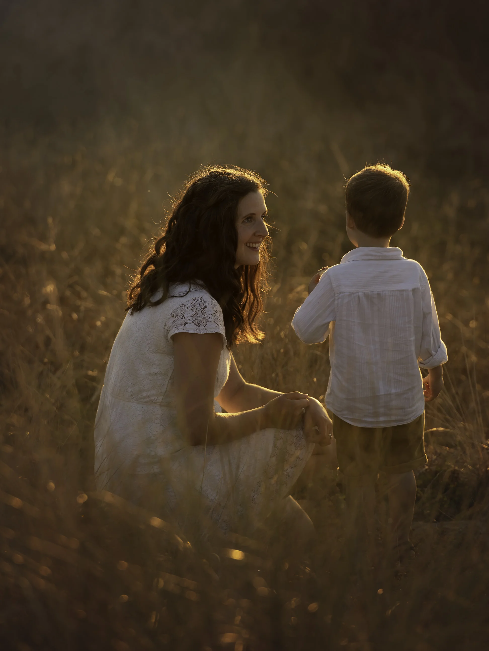 Mother and son at sunset in dunes