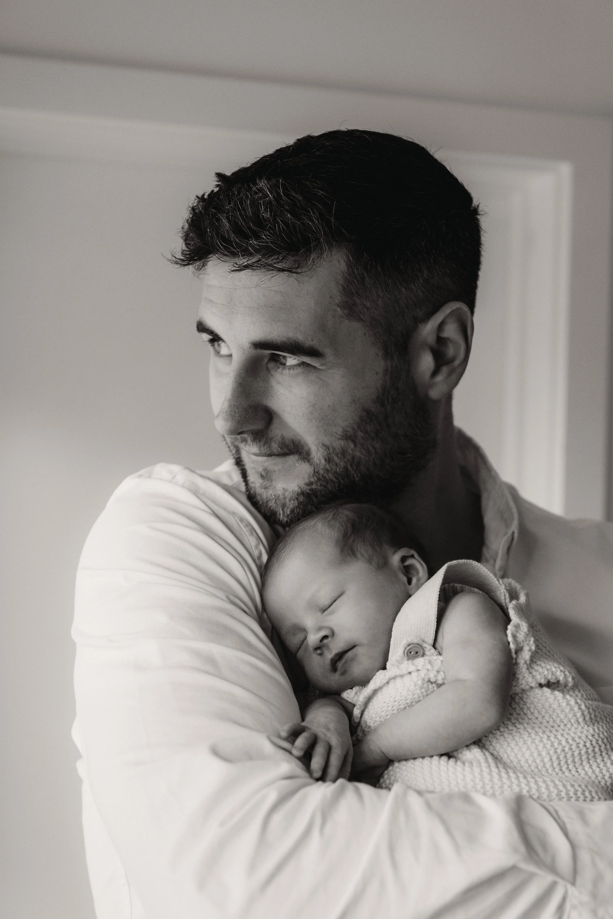 Jersey photographer - father and newborn girl at home