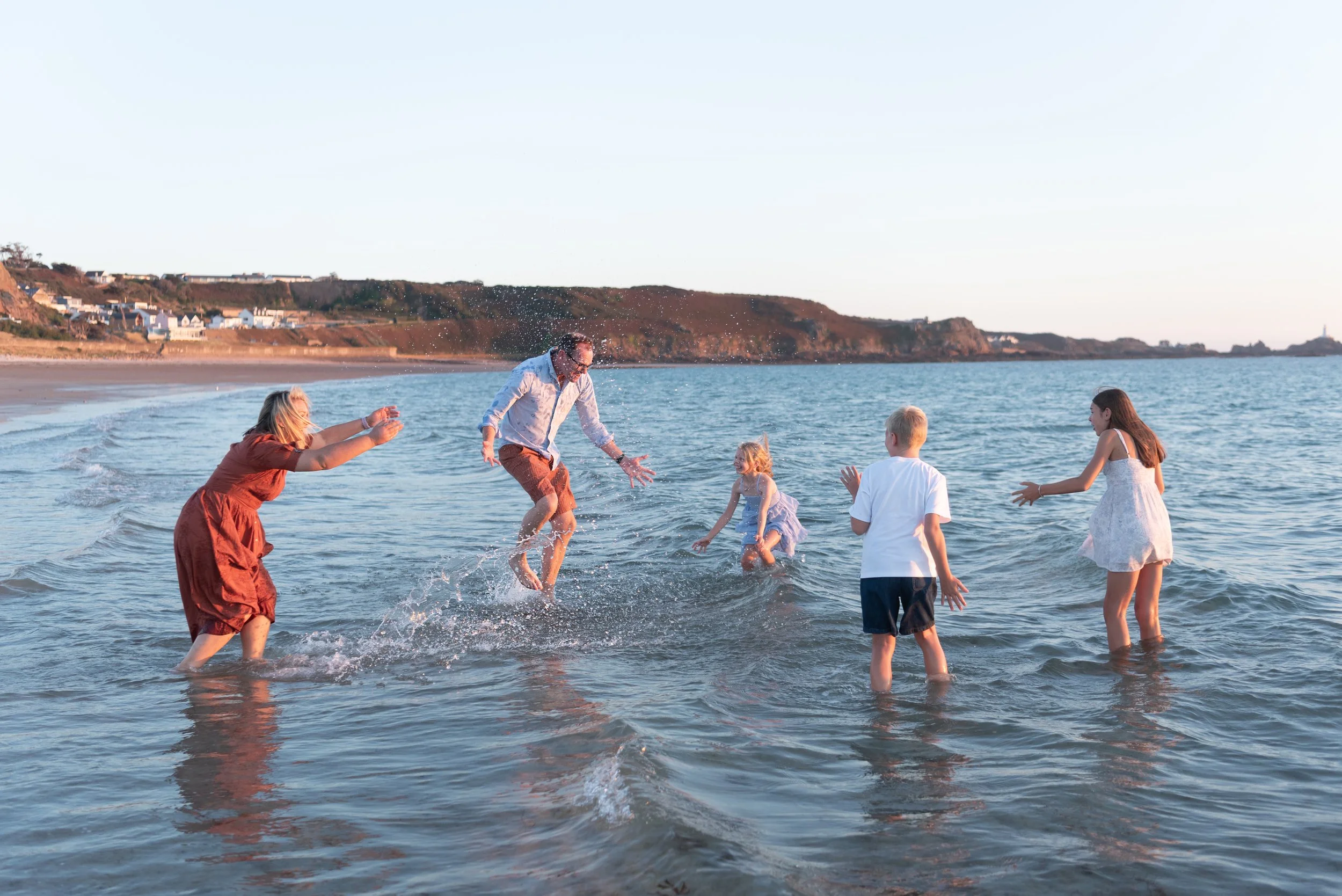 Jersey photographer - family water fight in sea
