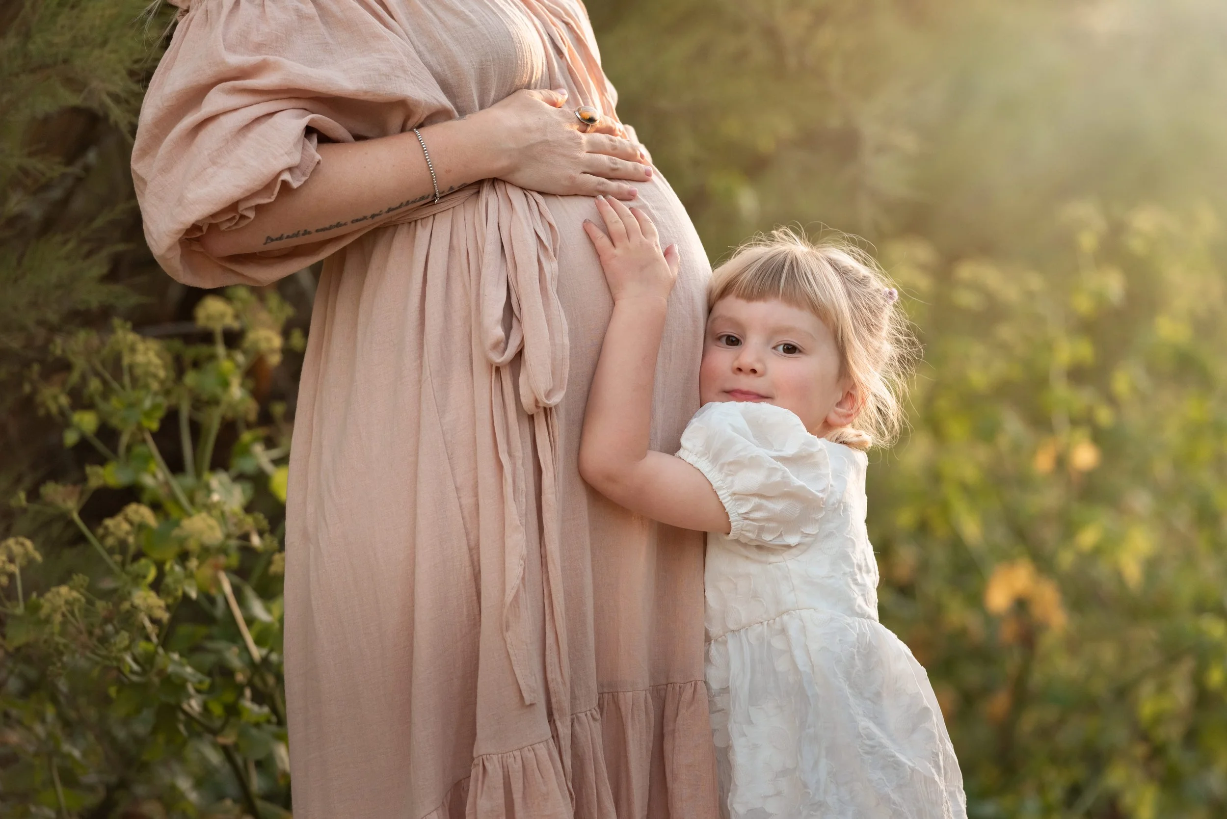Jersey photographer - daughter hugging baby bump