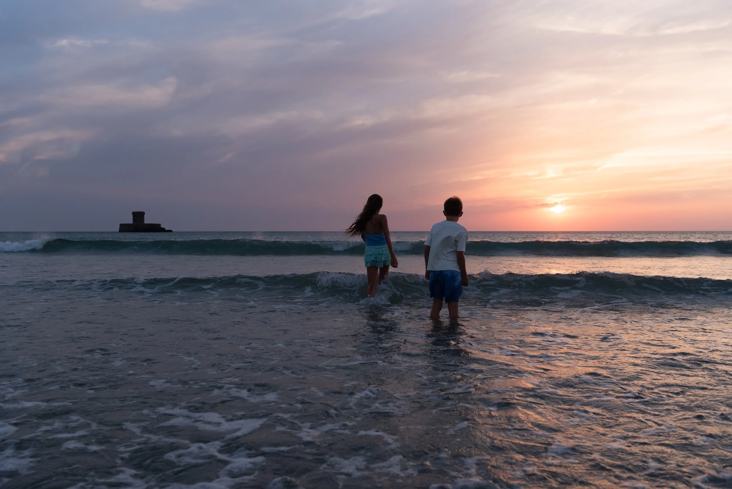 Jersey photographer - children splashing in sea