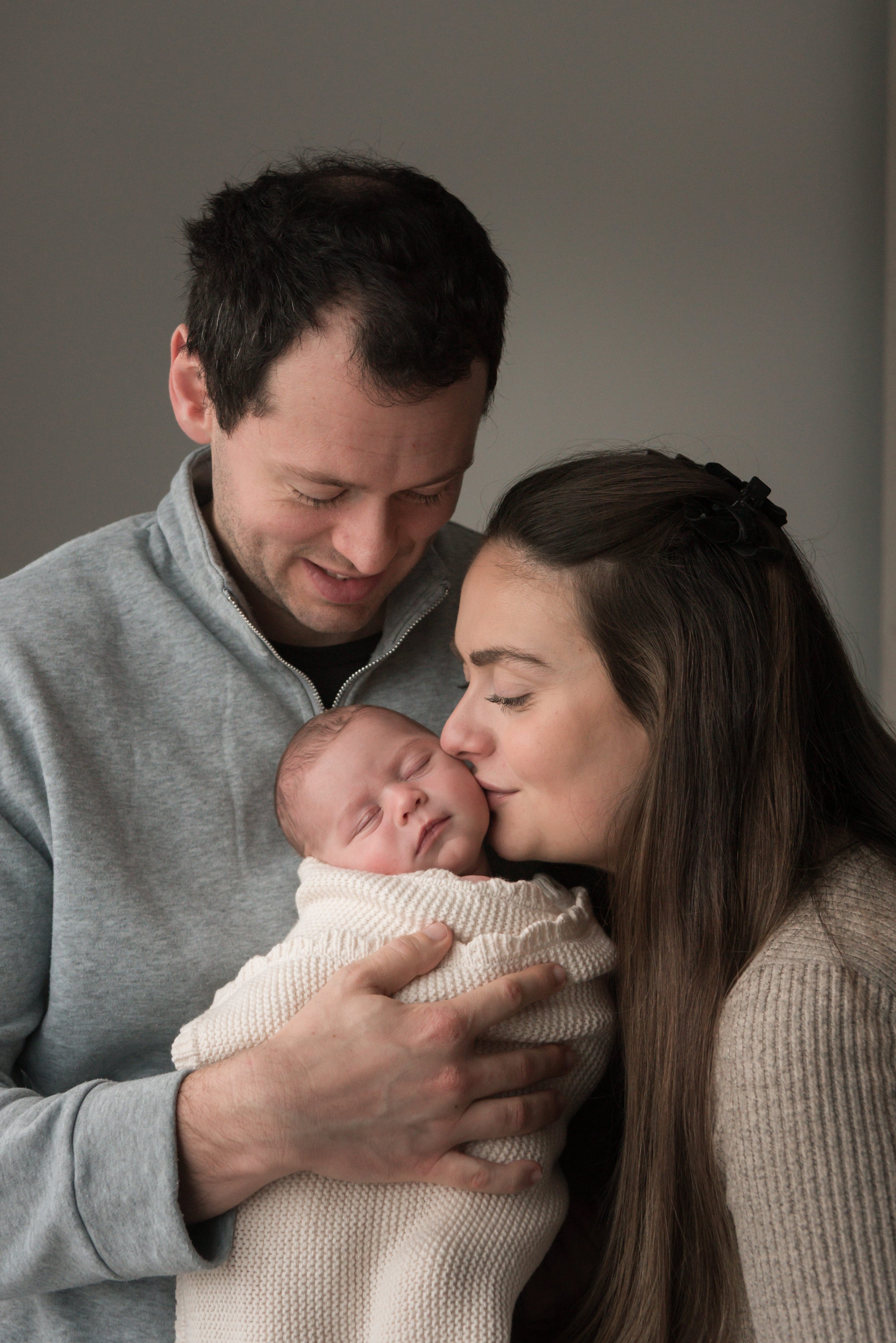 Jersey photographer - newborn girl in parents arms