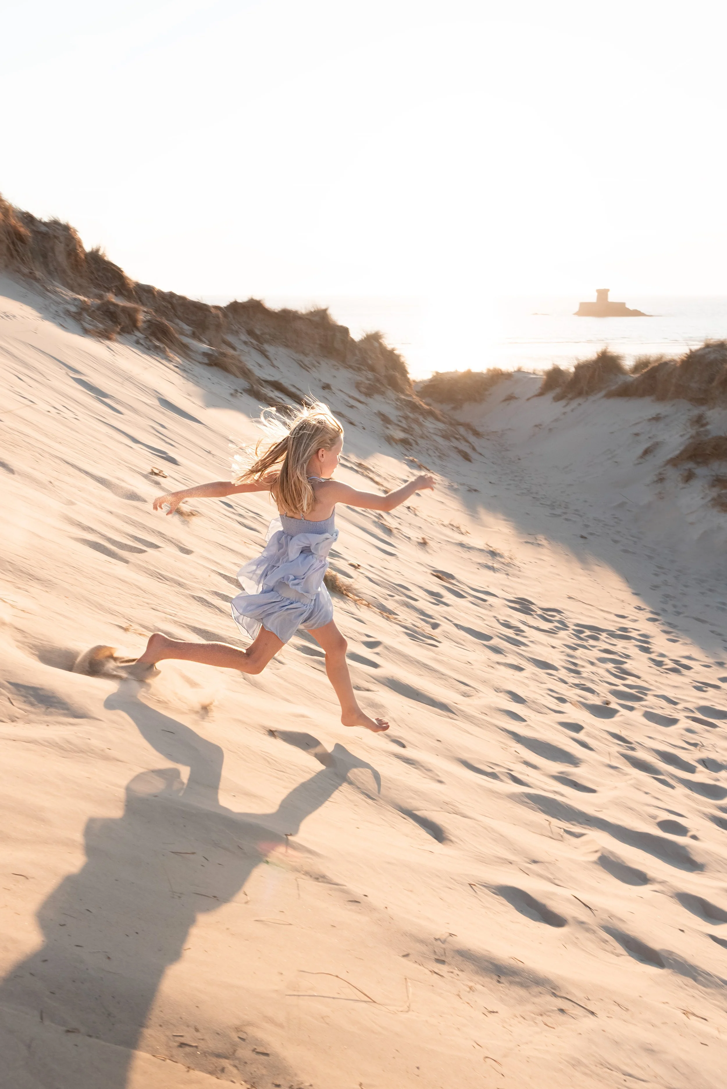 Jersey photographer - girl running down dune.
