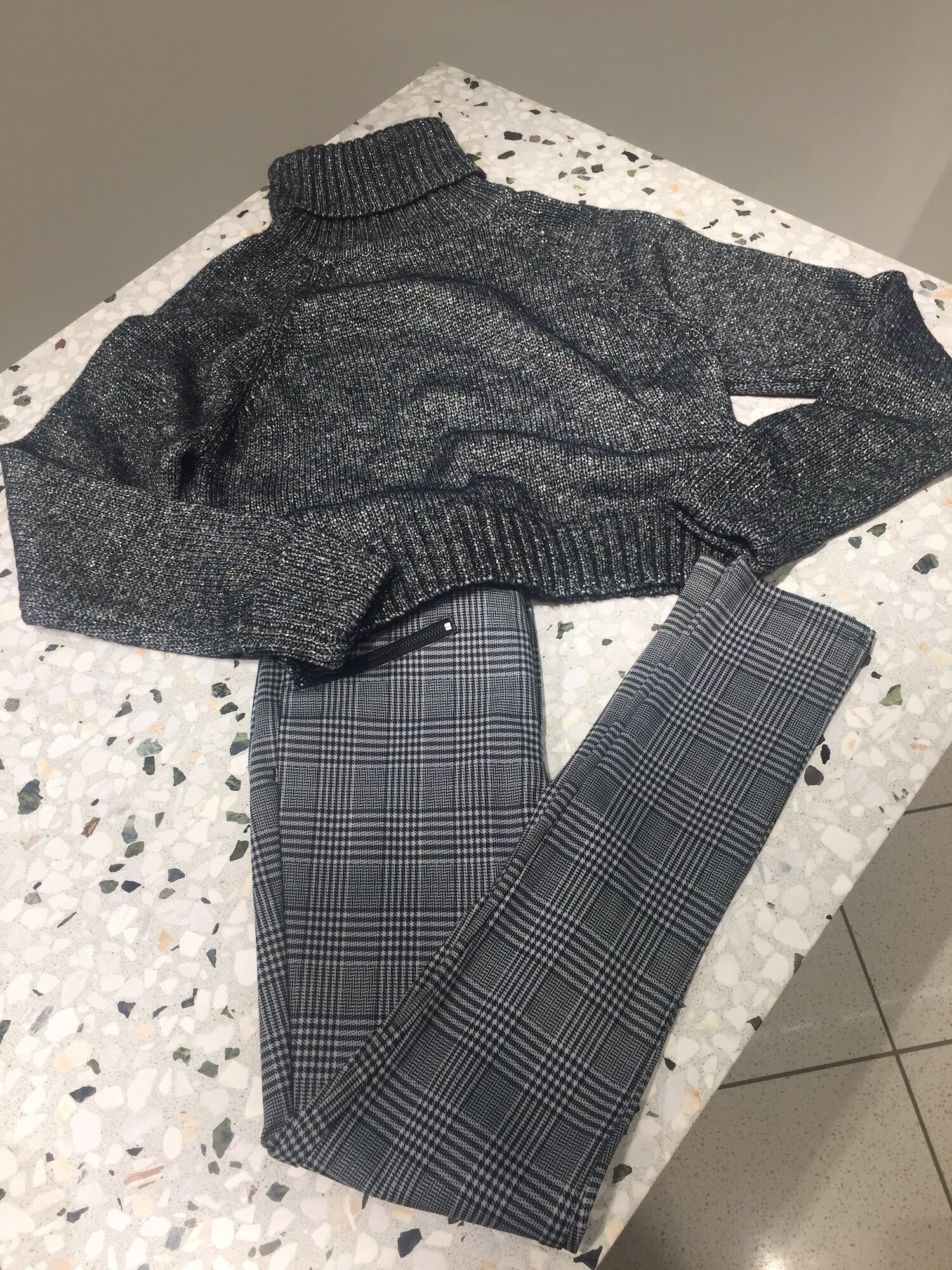 Simple, classic and chic; you can’t go wrong with a slim slack in a trendy plaid print and a cozy turtleneck. Paired with a black booty or simple black leather sneaker, this outfit works for the 9 to 5 and for running errands on the weekend. Outfit from Nordstrom.
