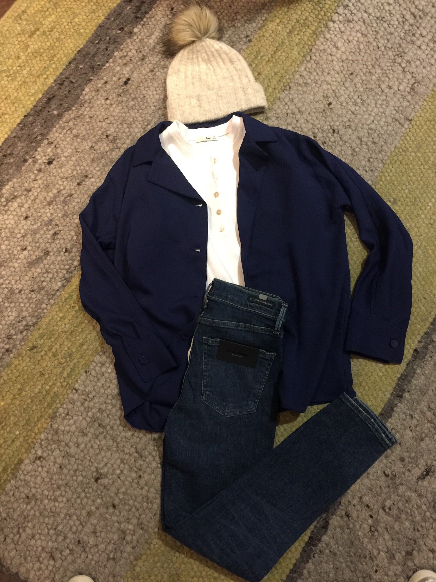 Jeans work for the office; just make sure they’re your best pair in a slim fit in a medium or dark wash. This outfit would be perfect for casual Friday paired with a leather lace-up brogue. We’ve styled these dark Citizen jeans with a white shirt and loose navy shirt jacket. Outfit from Aritzia.