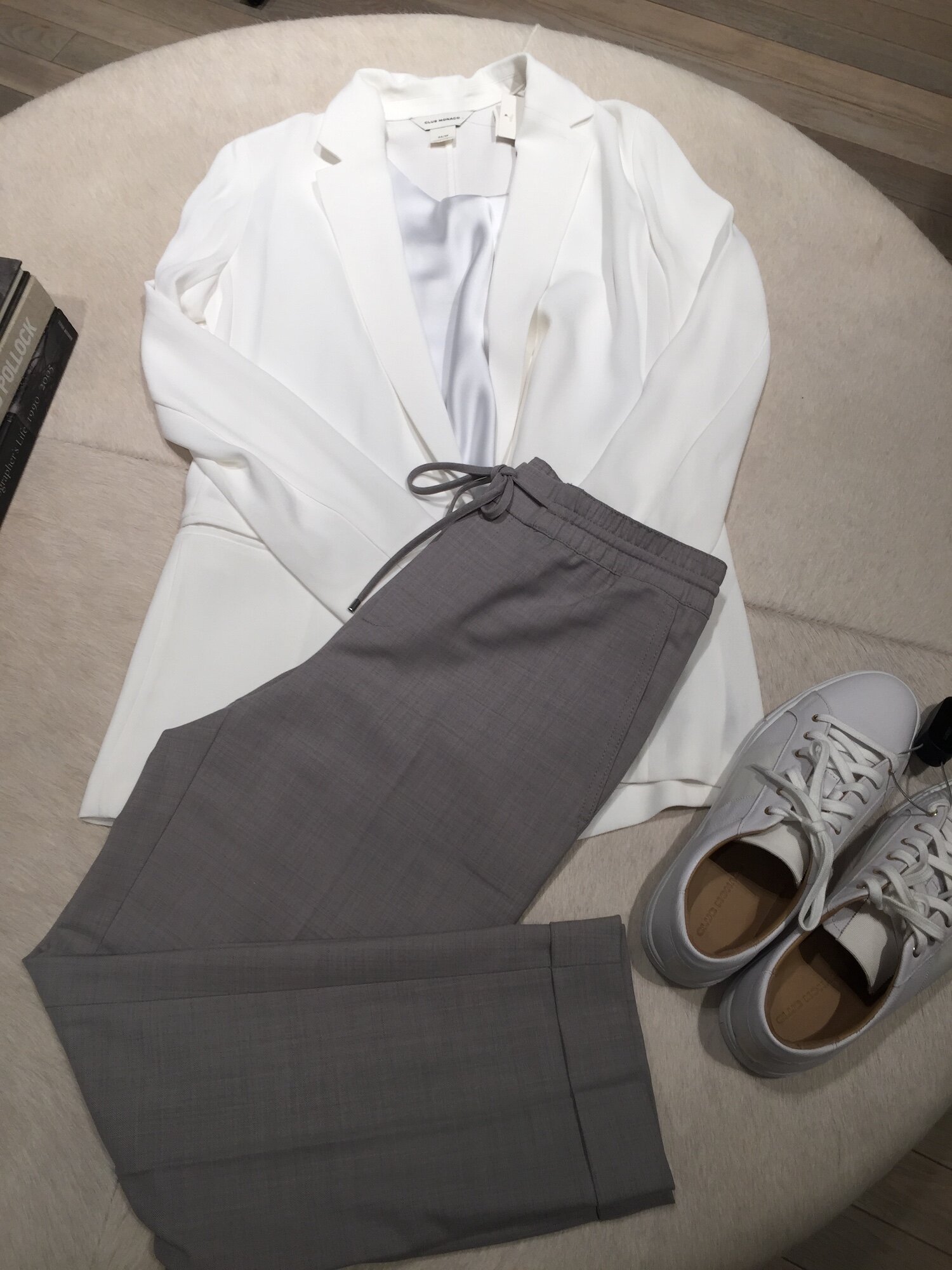 While blazers usually scream ‘office’, this one is unstructured making it a perfect choice. Paired with a simple grey wool loose slack and white kicks, it’s a comfortable yet chic office look. Switch out the blazer for a simple black turtleneck for weekend brunch. Outfit from Club Monaco.