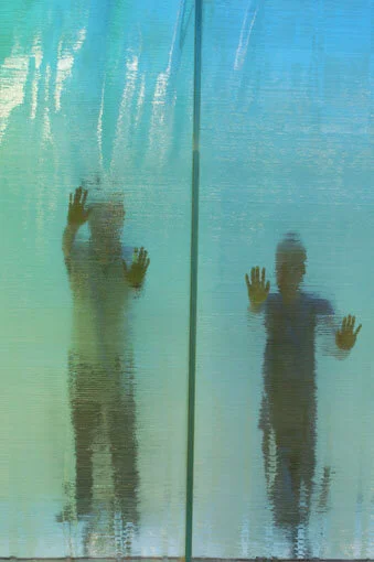  Image of people behind the glass wall 