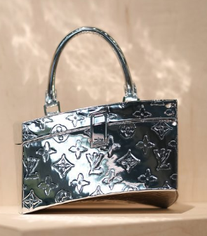 Twisted Box Bag Photos by Mario Kroes <br>via dezeen.com