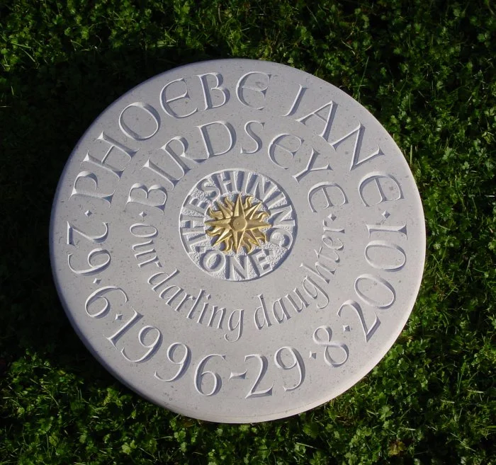 Raised and incised lettering with relief carving